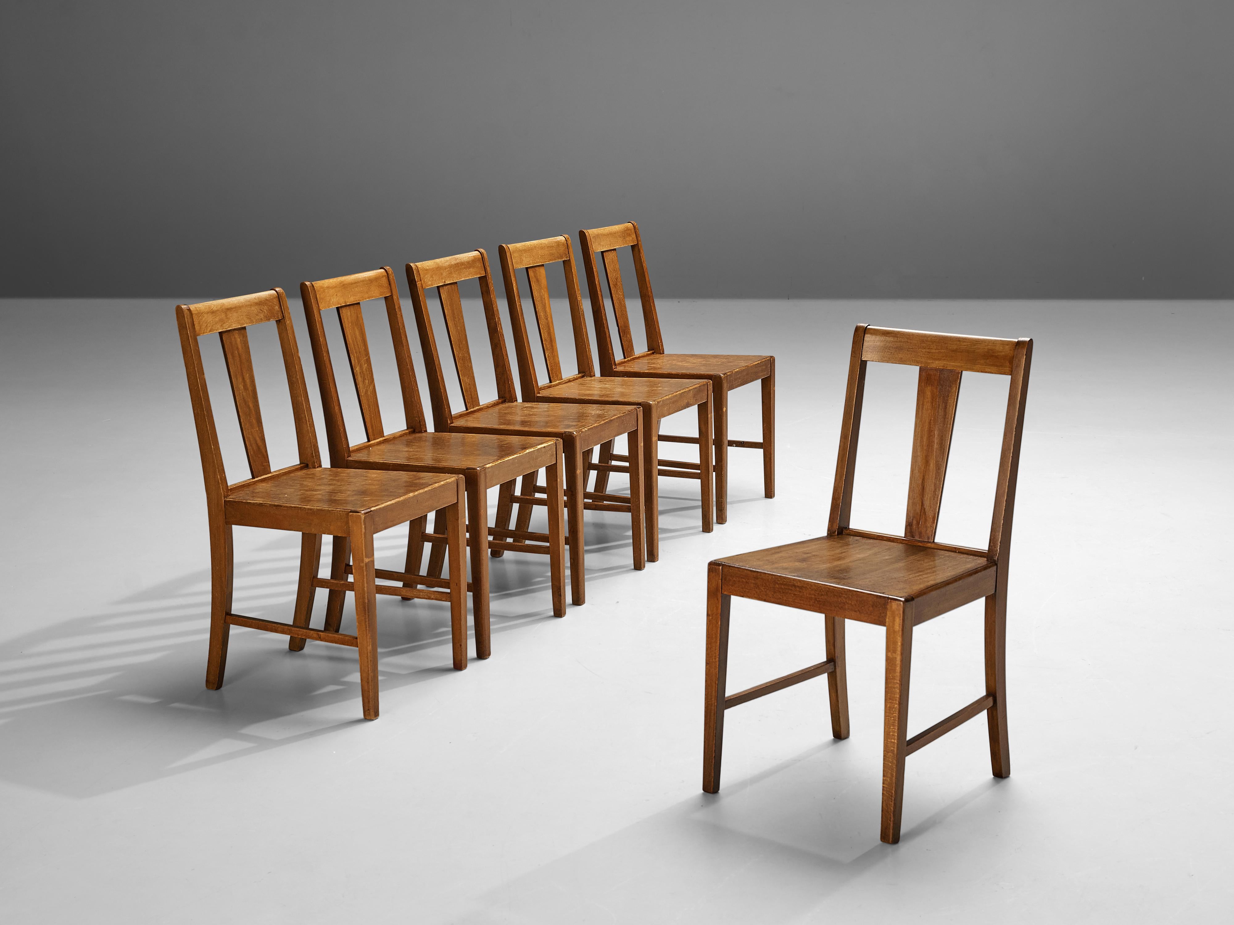 Dining chairs, stained beech, The Netherlands, 1940s

This set of dining chairs is designed with a perfectly balanced backrest and sturdy overall frame. The robust structure is evident in the solidly built legs, contributing to the chairs'