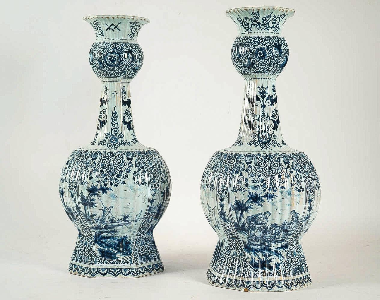 A rare and a monumental Delft faience blue cameo and a white color pair of gourd-shaped vases or gourd-shaped, decorated with an hand-painted landscape and farmer scene, opaque tin glazes that made in Delft 17th or 18th century.

Our pair of vases