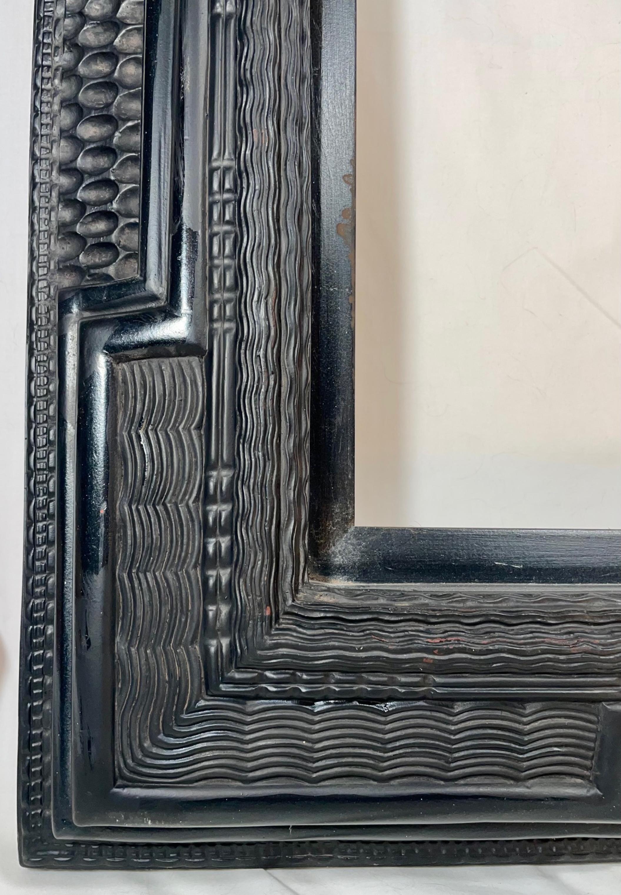 Dutch Ebonized Ripple Moulded Picture Frame Early 20th Century.

Classic Dutch old master ebonized frame with multiple ripple moulding. The depth and detail is exceptional. The moulding is highlighted by a ripple panel pattern with a finish that