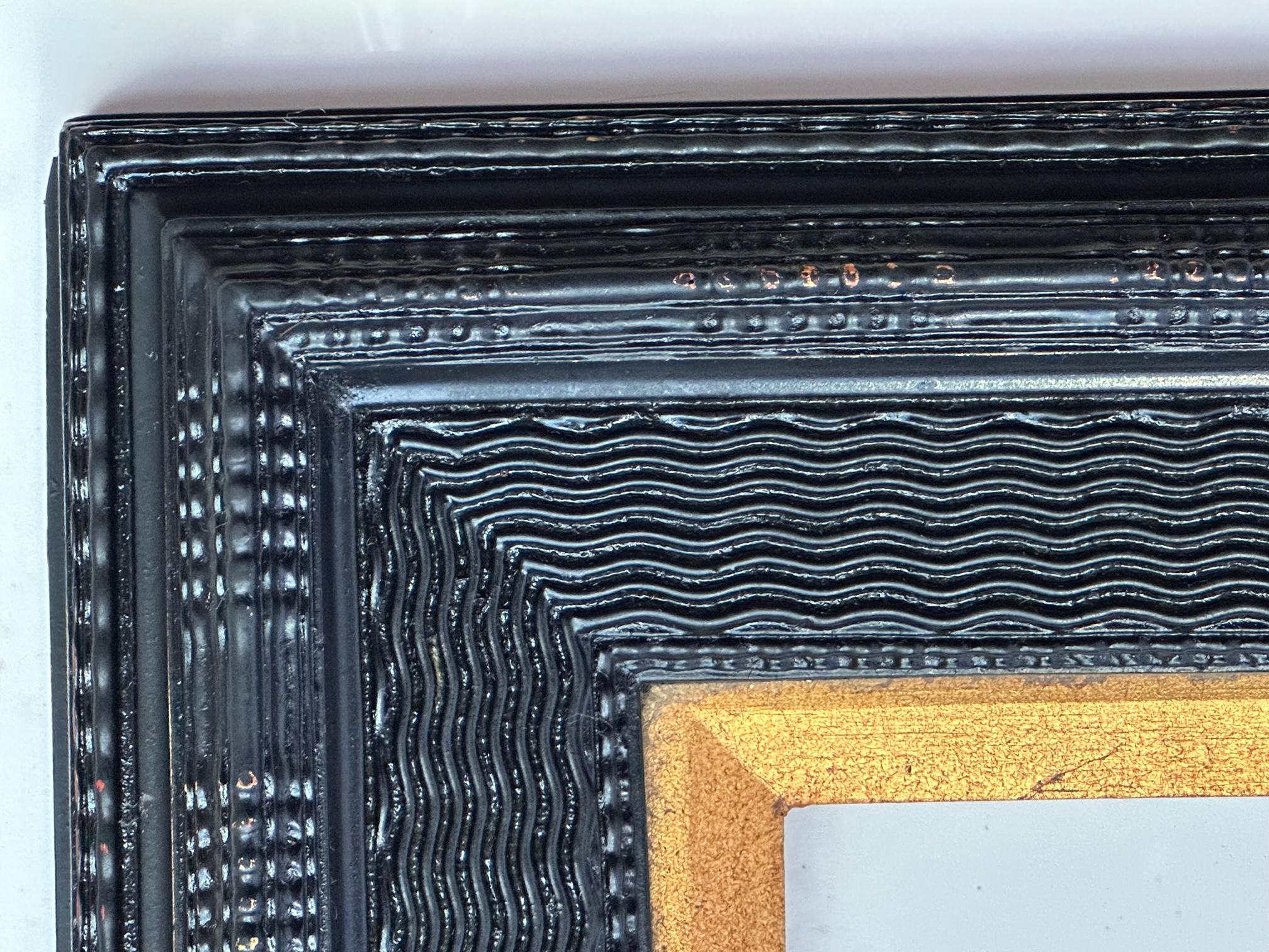 Dutch Ebonized Ripple Molded Picture Frame Early 20th Century.

Classic Dutch Old Master ebonized frame with multiple ripple molding. The depth and detail is exceptional. The molding is highlighted by a ripple panel pattern with a finish that