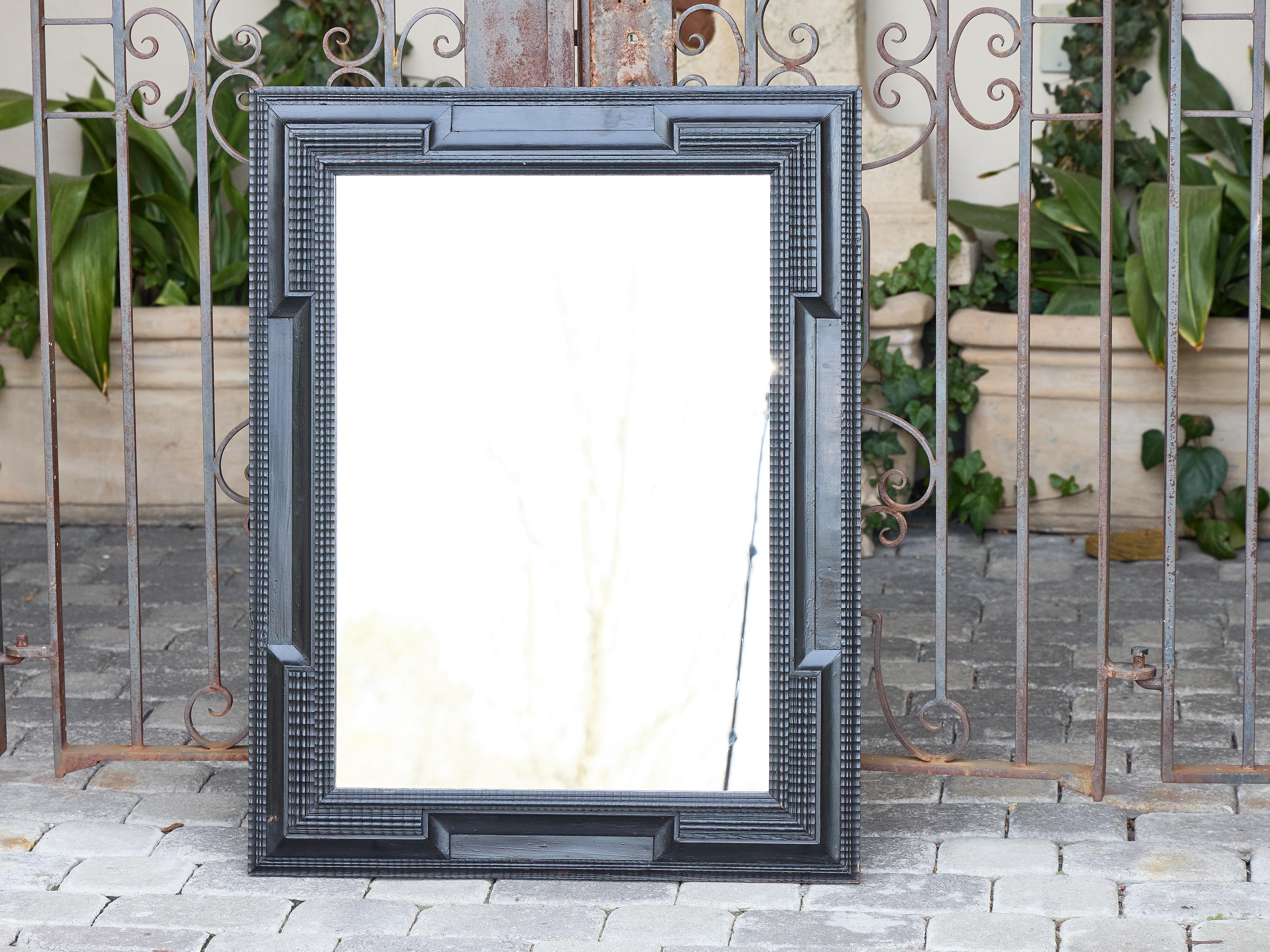 Baroque Revival Dutch Ebonized Wood Mirror with Carved Geometric Frame, circa 1900 For Sale