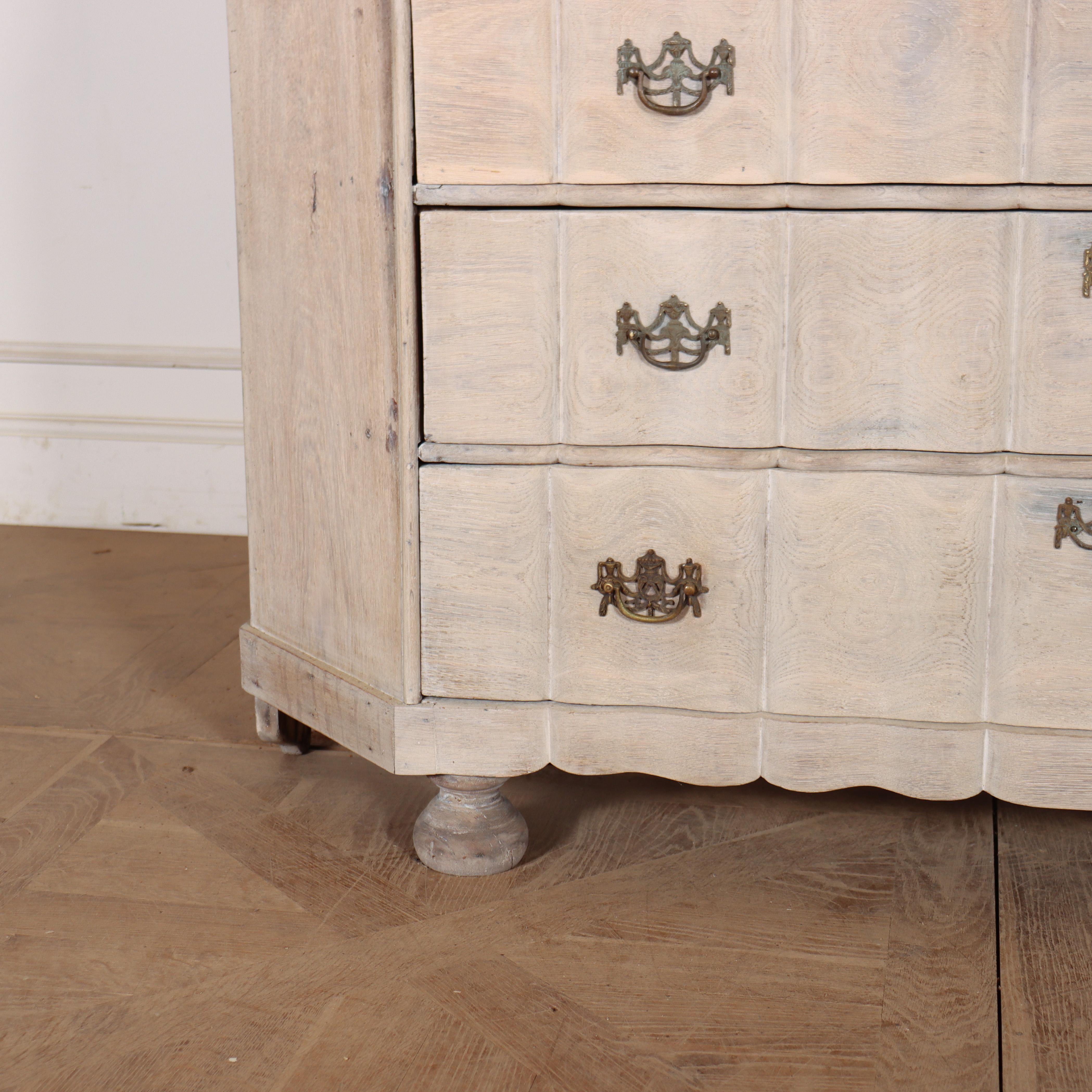 Good 18th century Dutch glazed display cabinet with serpentine front drawers and a bleached oak finish. 1790. 

Code: 9012

Dimensions:
W: 65