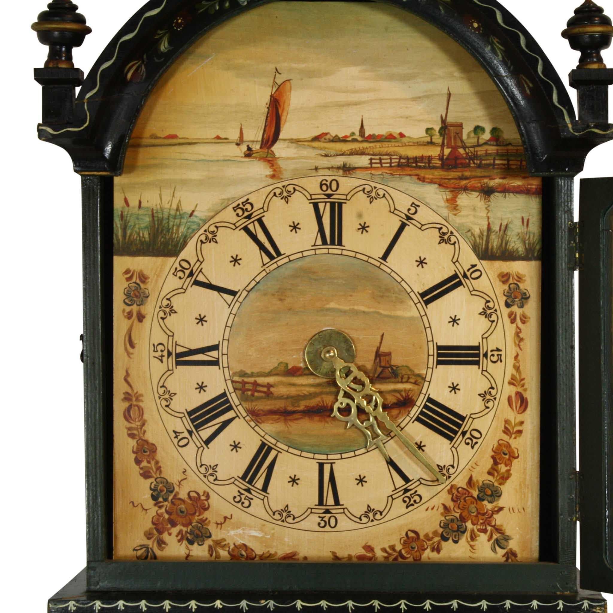 Tall case clocks like this one are often referred to as grandmother clocks because they are shorter than grandfather clocks. Hand-painted in Holland in traditional, Folk Art style, the clock features foliage, flowers, and birds. The diameter of the