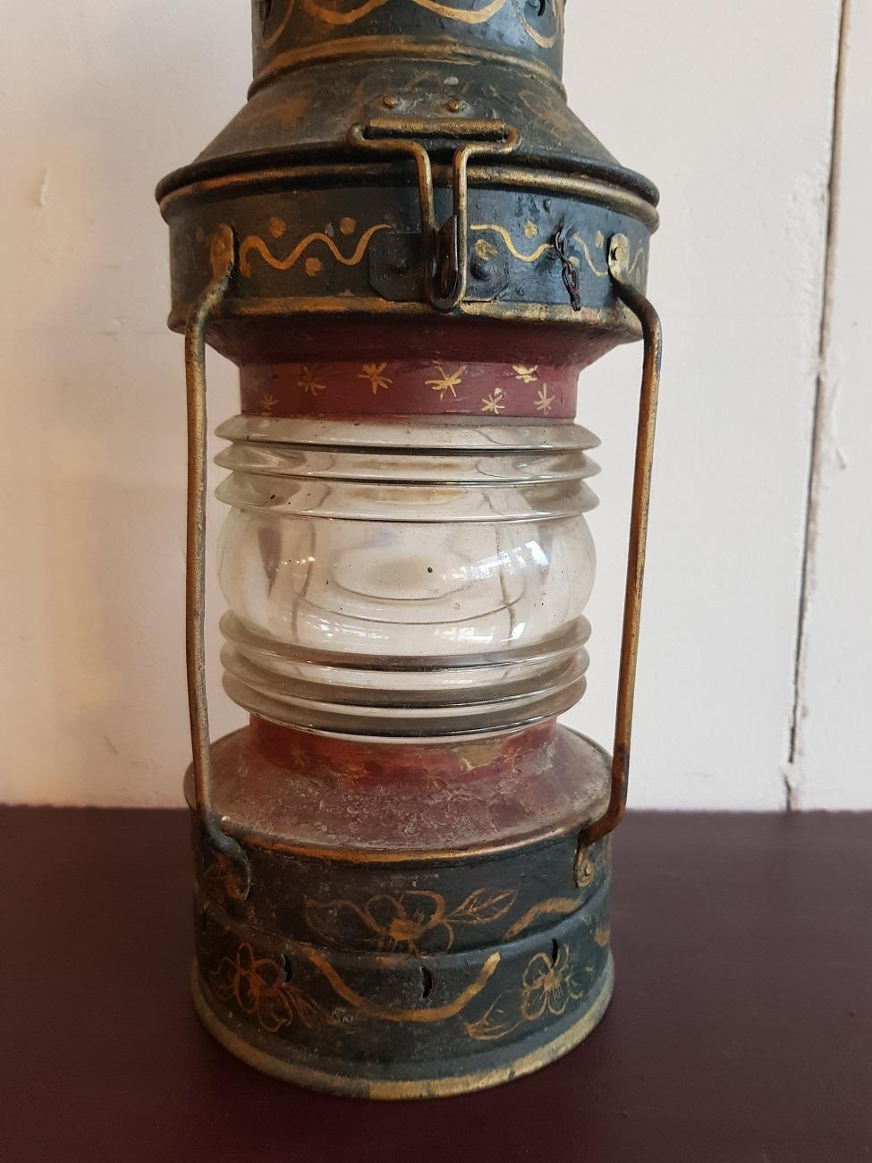 Old nostalgic hand painted anchor light with gold trim, this one is without the oil lamp and not made electrically, from circa 1900.

The measurements are:
Depth 16 cm/ 6.2 inch.
Width 16 cm/ 6.2 inch.
Height 43 cm/ 16.9 inch.