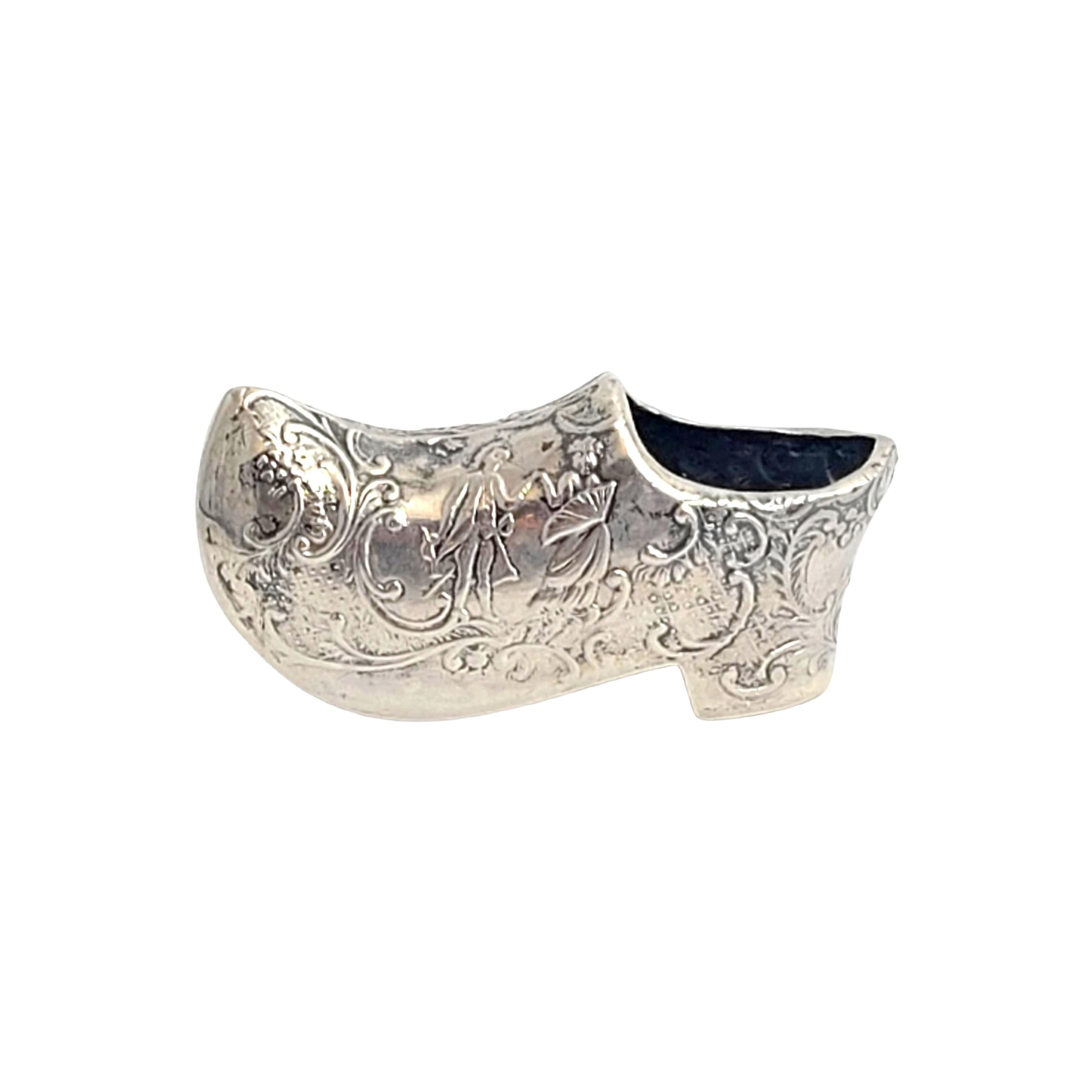 Dutch 835 silver clog.

This is a beautiful and charming small clog figurine is adorned with a repousse design.

Measures approx 2 1/2