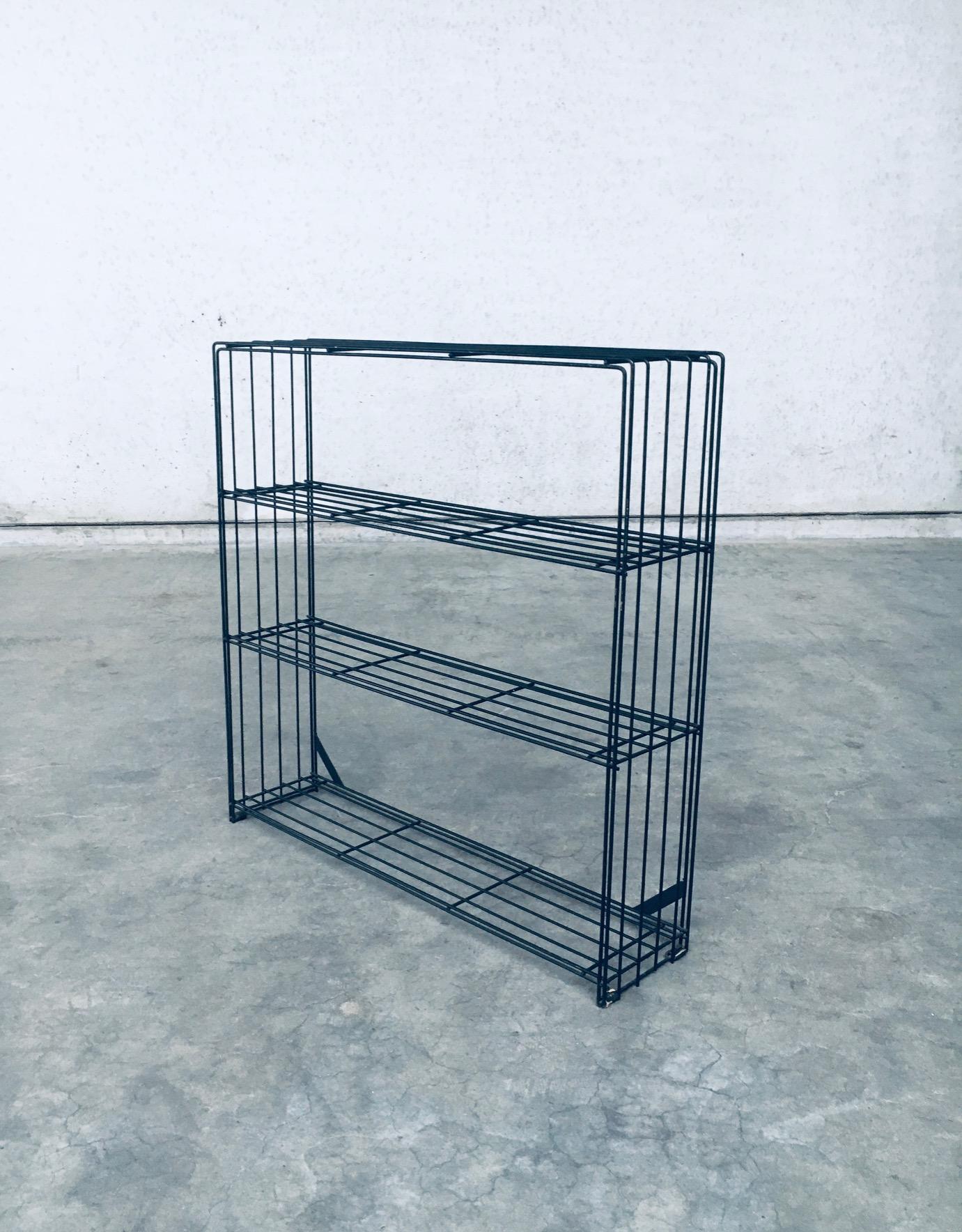 Vintage Midcentury Modern Dutch Industrial Design Storage Rack by Tjerk Reijenga for Pilastro. Made in the Netherlands, 1958. Minimalist and architectural in design. Storage rack, display shelves or book case. Black lacquered metal wire frame