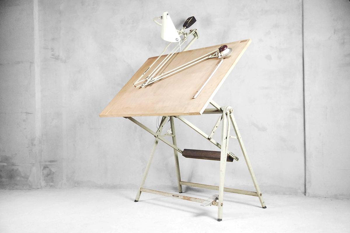 This architectural drawing table was manufactured in Netherlands and designed by Rotanex-Pool, n.v. Wormerveer Holland during the 1950s. It has a simple frame made from metal. The table is adjustable and can be put in any positions and secured in