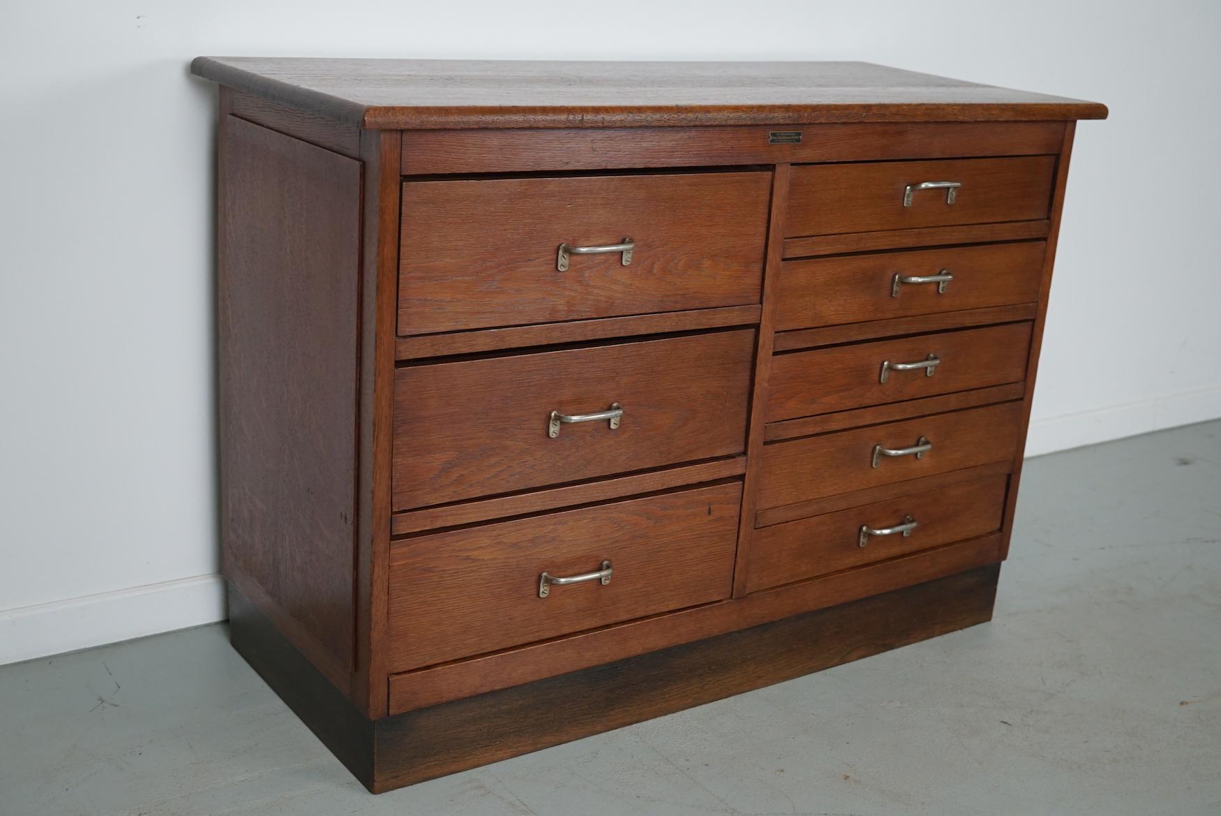 This apothecary cabinet was made circa 1950s in the Netherlands. The cabinet was used in a workshop. It features 8 drawers in 2 different sizes with metal handles. The interior dimensions of the drawers are: D W H 37 x 45 x 14 and 7.5 cm.