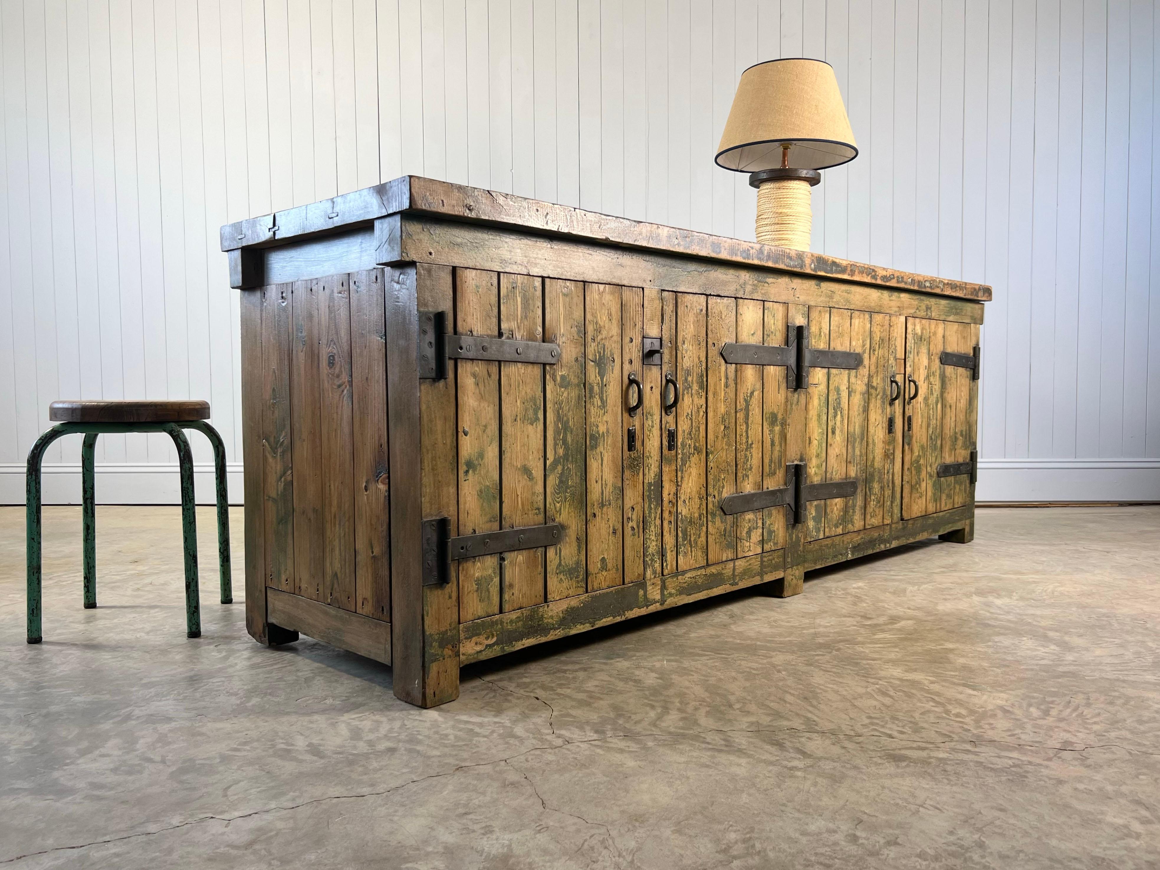 This heavy duty workbench was sourced from a factory in Holland.  The chunky top and frame is made from oak and the rest is pine - it is very very heavy ! Circa 1900.

We bought it restored and they have done a very good job, everything is cleaned