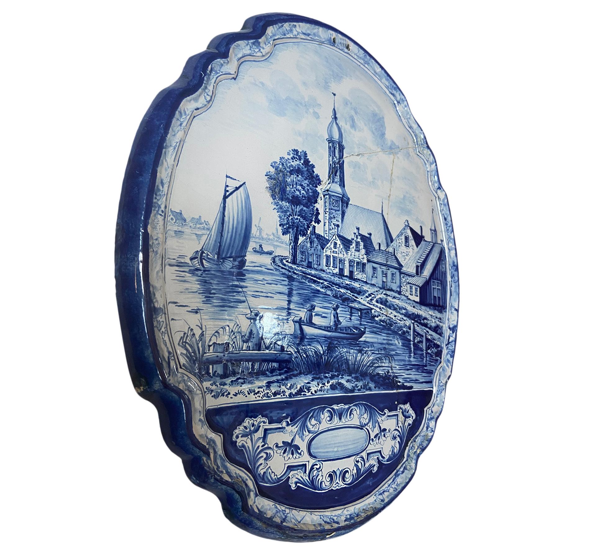 A 19th century Dutch porcelain wall plaque with landscape. 

Measurements:
Height: 23