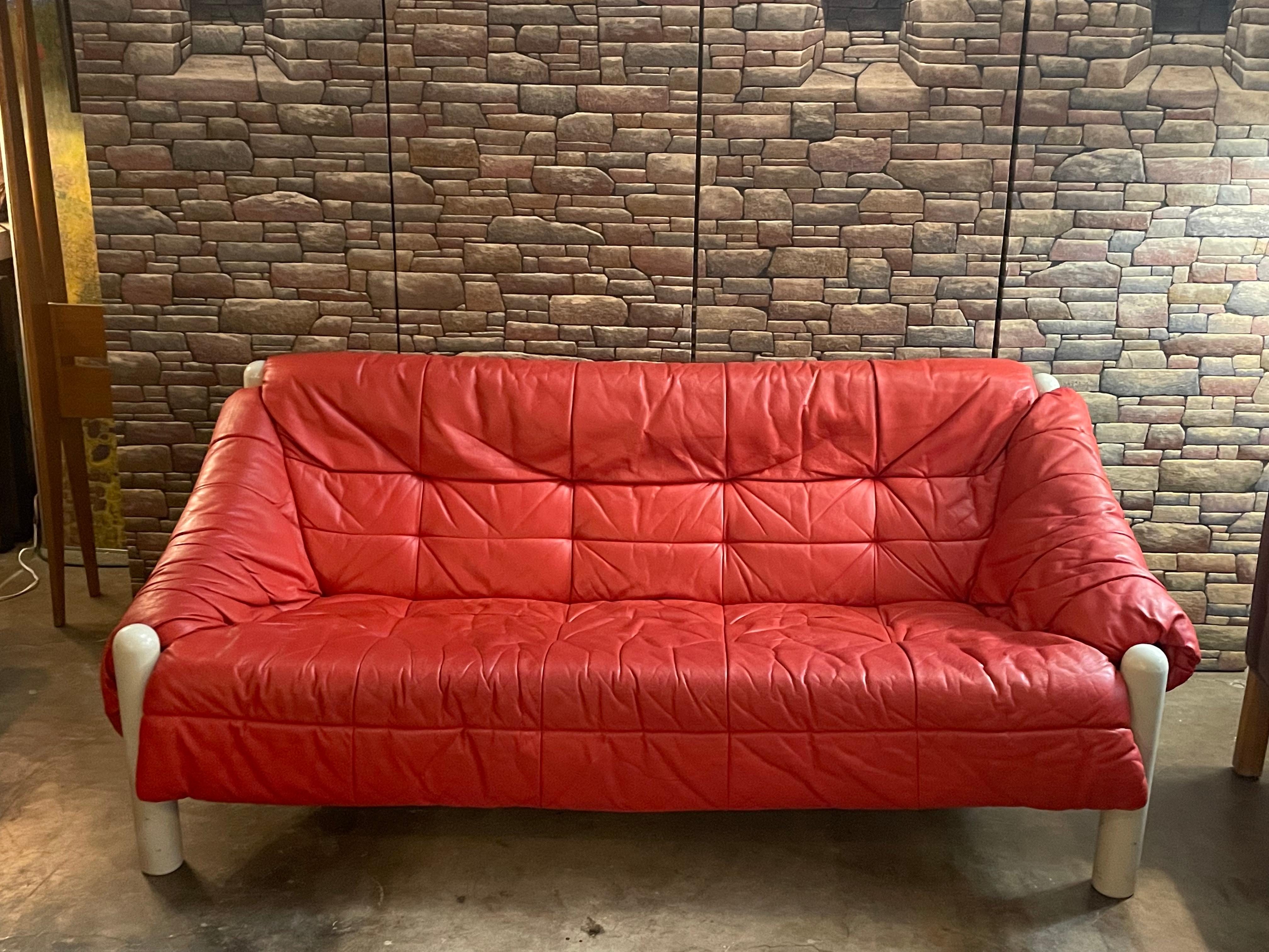 Dutch leather sling sofa with wooden legs painted white, circa 1970s and in good overall condition. 
Dimensions: 67