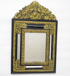 Dutch Looking Glass of Ebony and Brass Repoussé