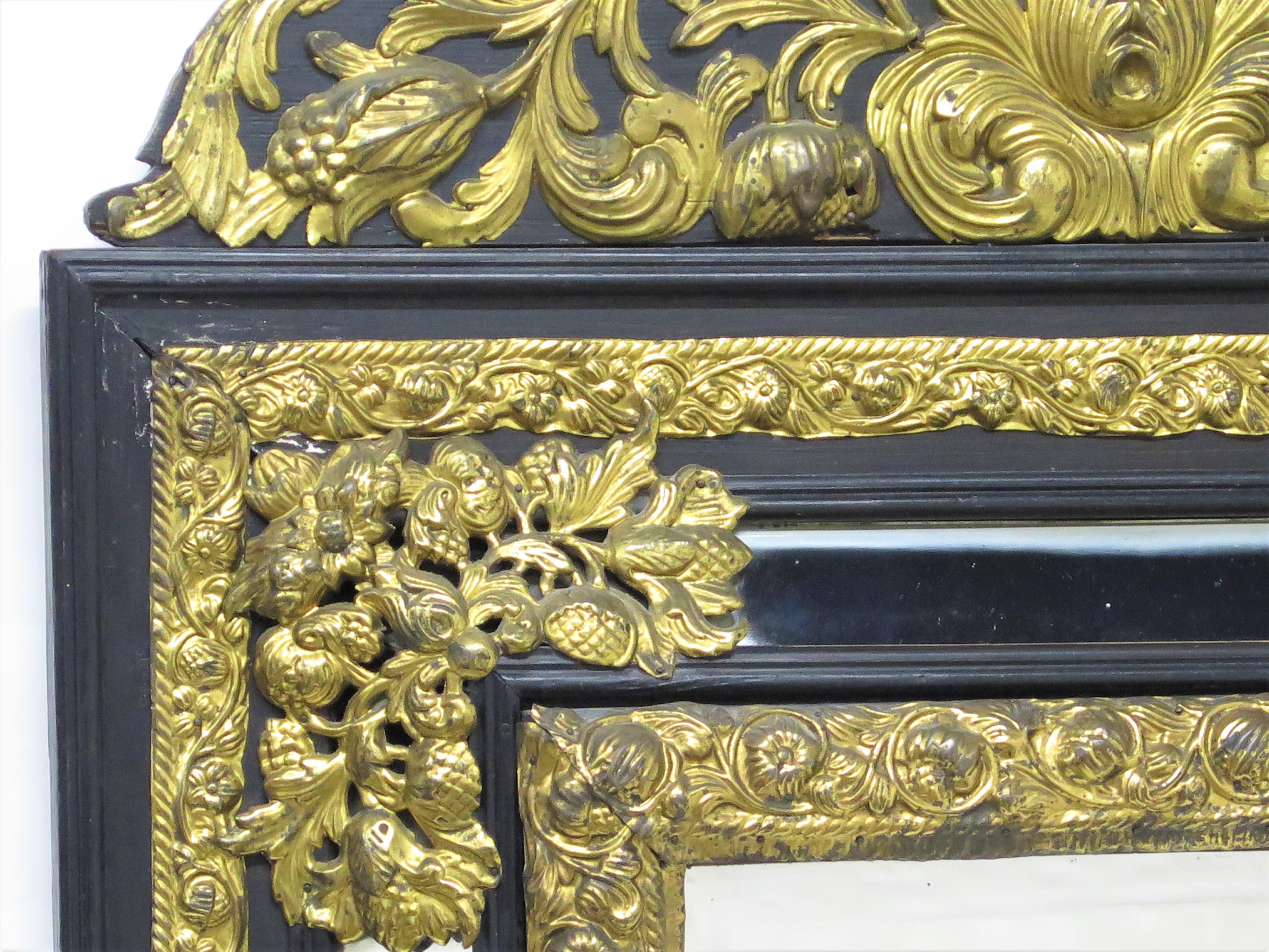 Dutch Looking Glass of Ebony and Brass Repoussé In Good Condition For Sale In Dallas, TX