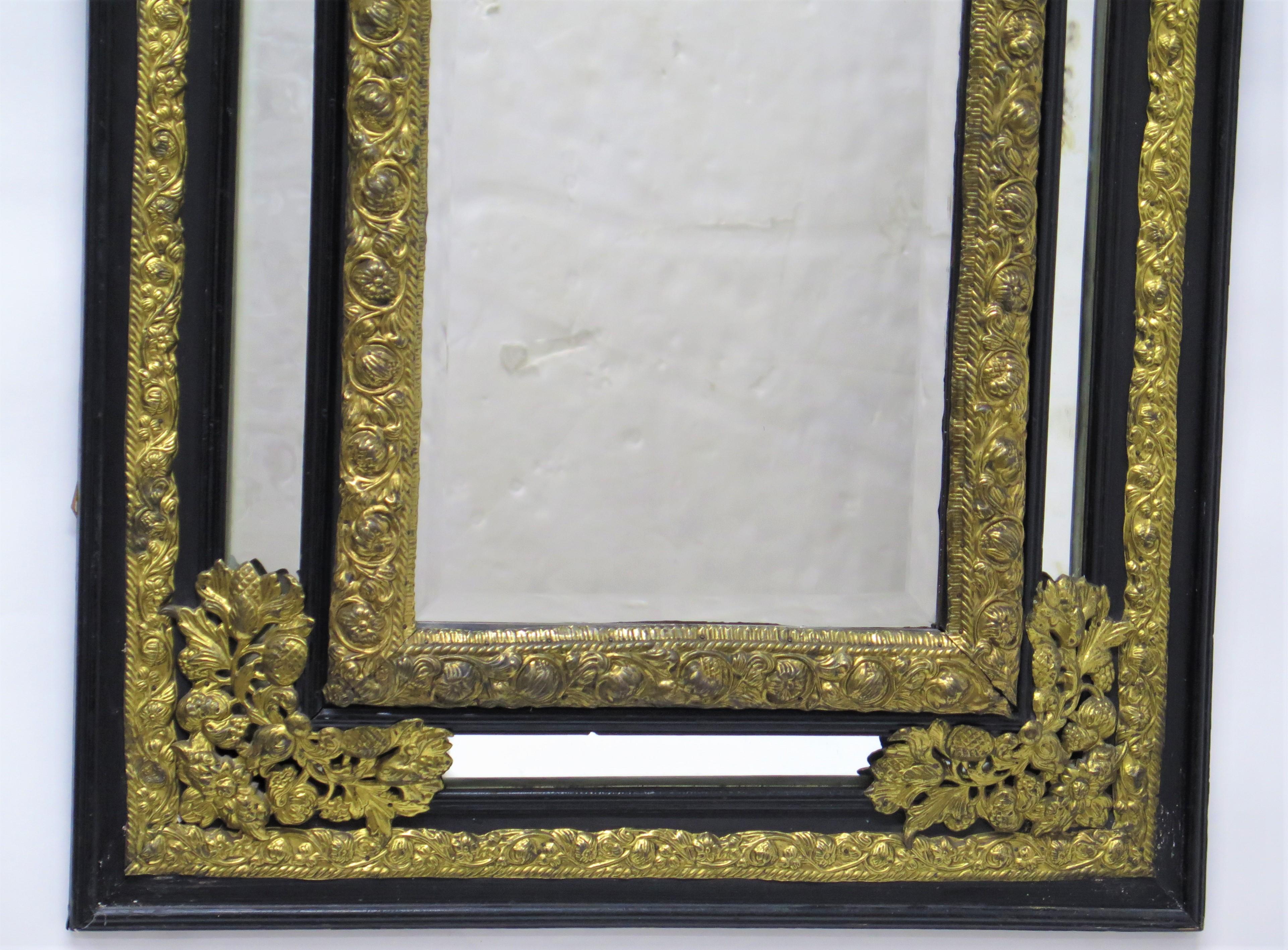19th Century Dutch Looking Glass of Ebony and Brass Repoussé For Sale