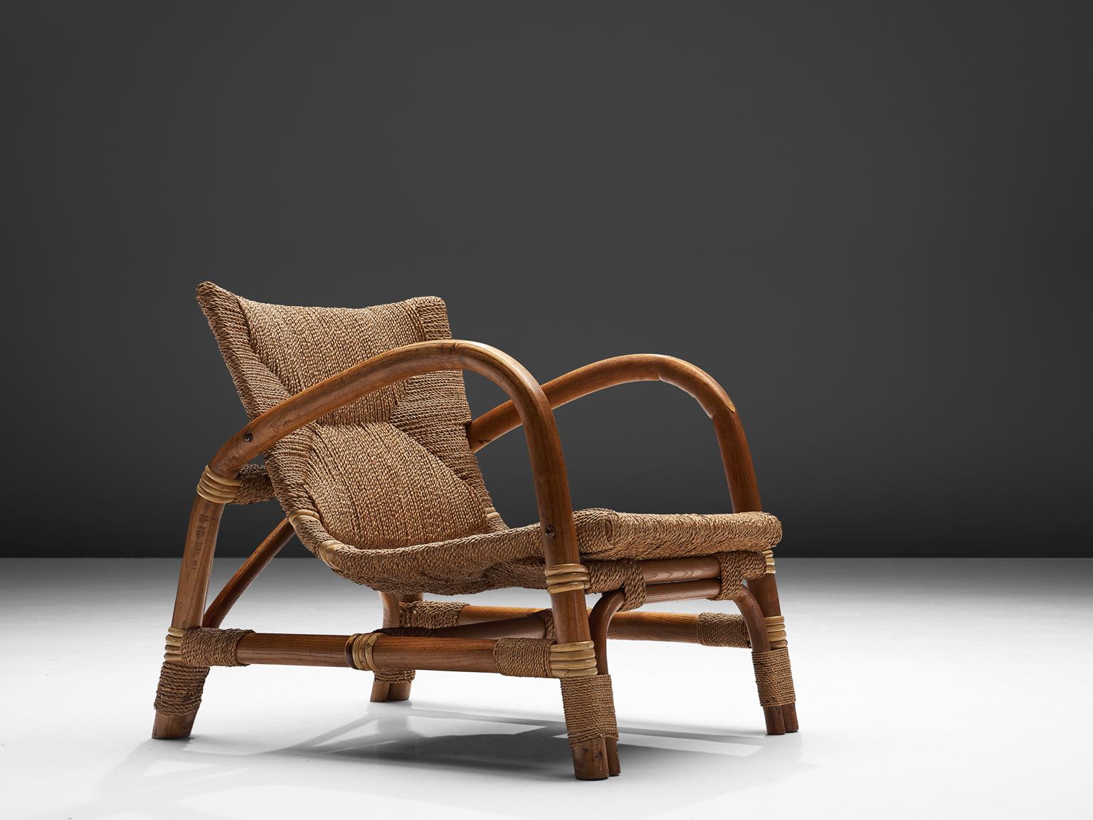 Wicker armchair, cane and beechwood, The Netherlands, 1960s

This well designed lounge chair has an open character. The warm expression of the two materials combined work well. The backseat overflows in the seat. The woven cane upholstery shows