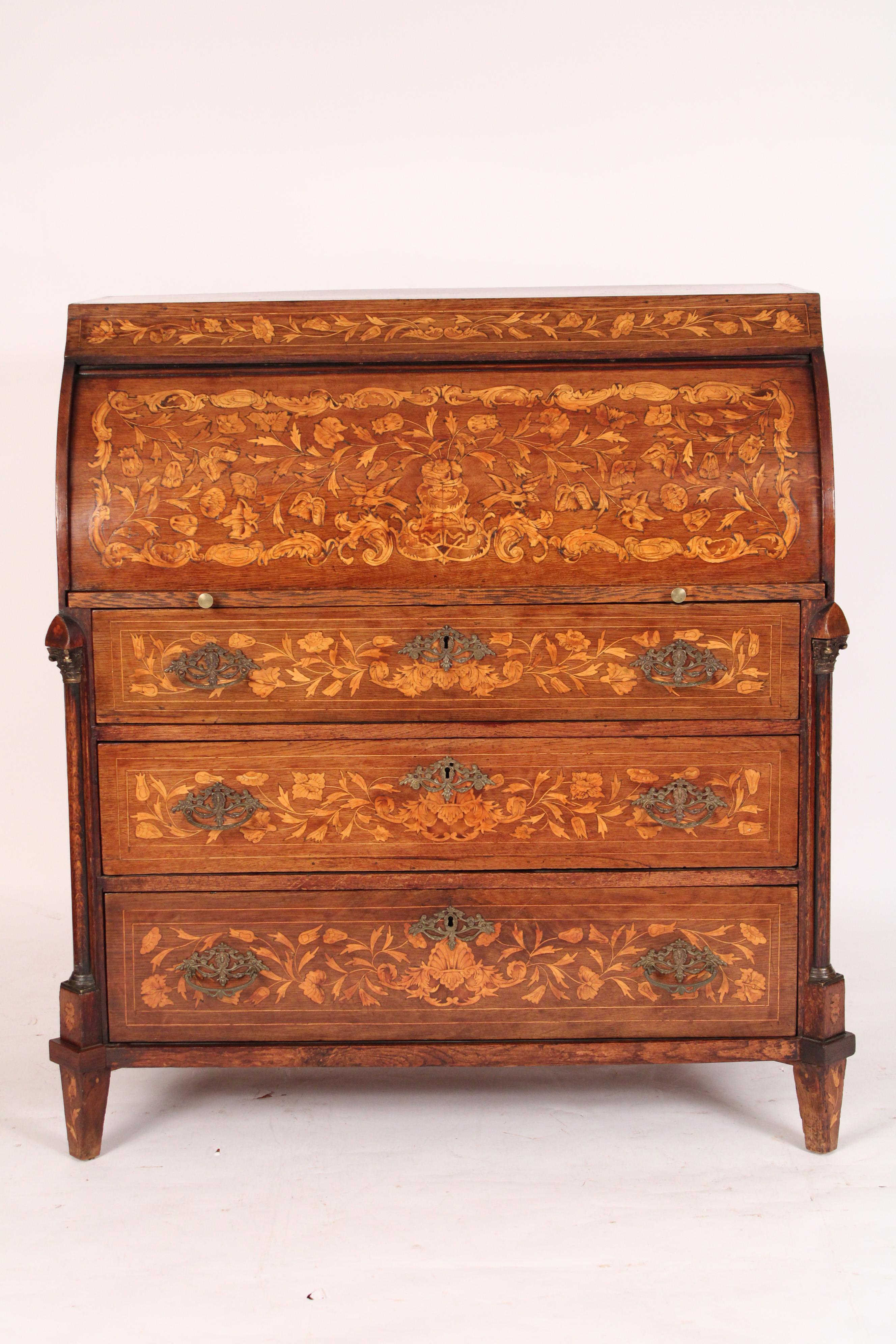 Dutch marquetry cylinder desk, 19th century. The top with conch shell and floral inlay, exposed dove tails where top and sides meet, the cylinder with bird and floral inlay, the interior writing surface with a central prospect door with urn inlay,