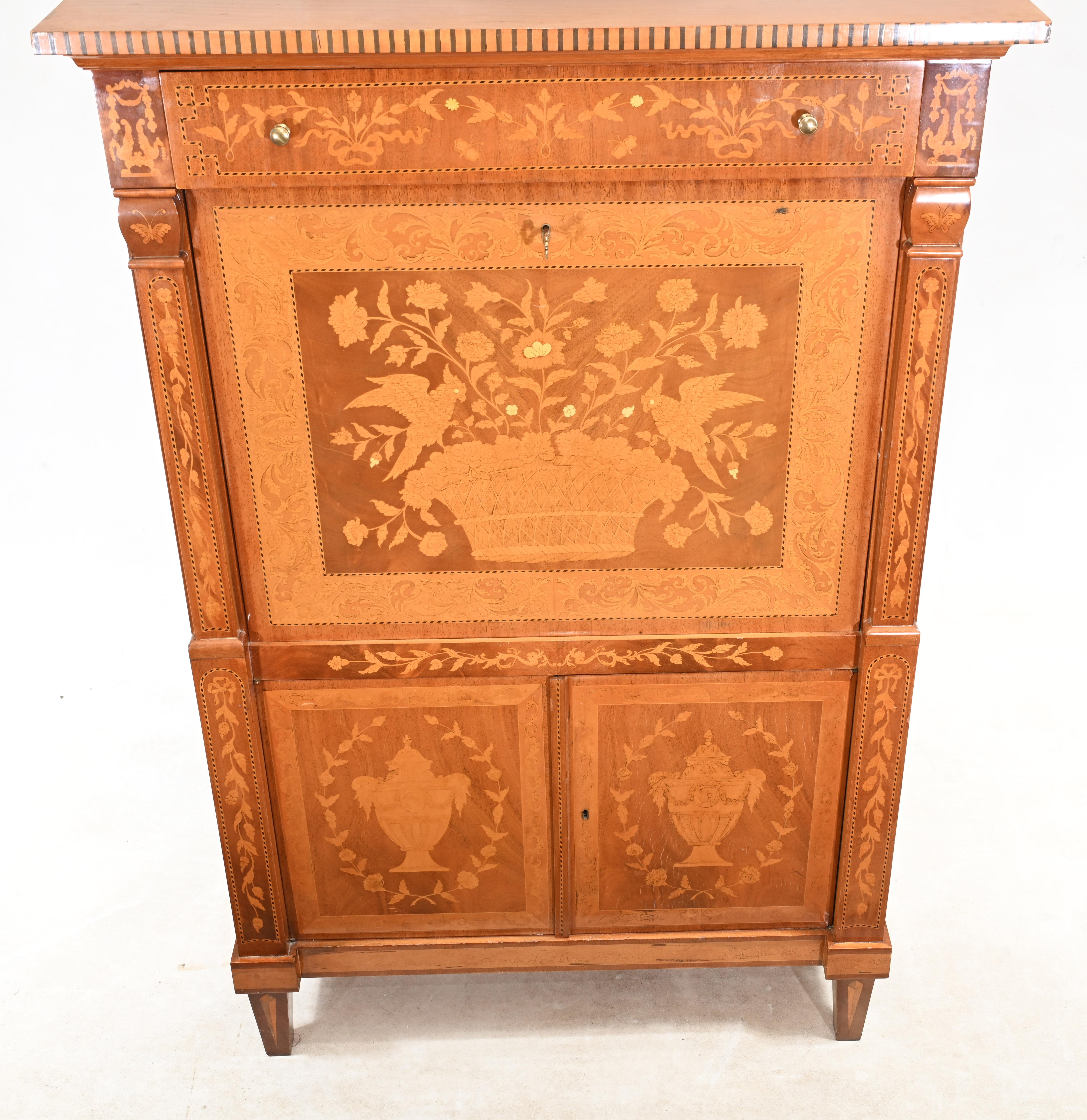 Large size Dutch marquetry escritoire profusely inlaid urns, flowers and birds 
Beautiful piece we date to circa 1890
Front opens out to reveal writing surface alongside drawers - 9 - and cubby holes
Some of our items are in storage so please