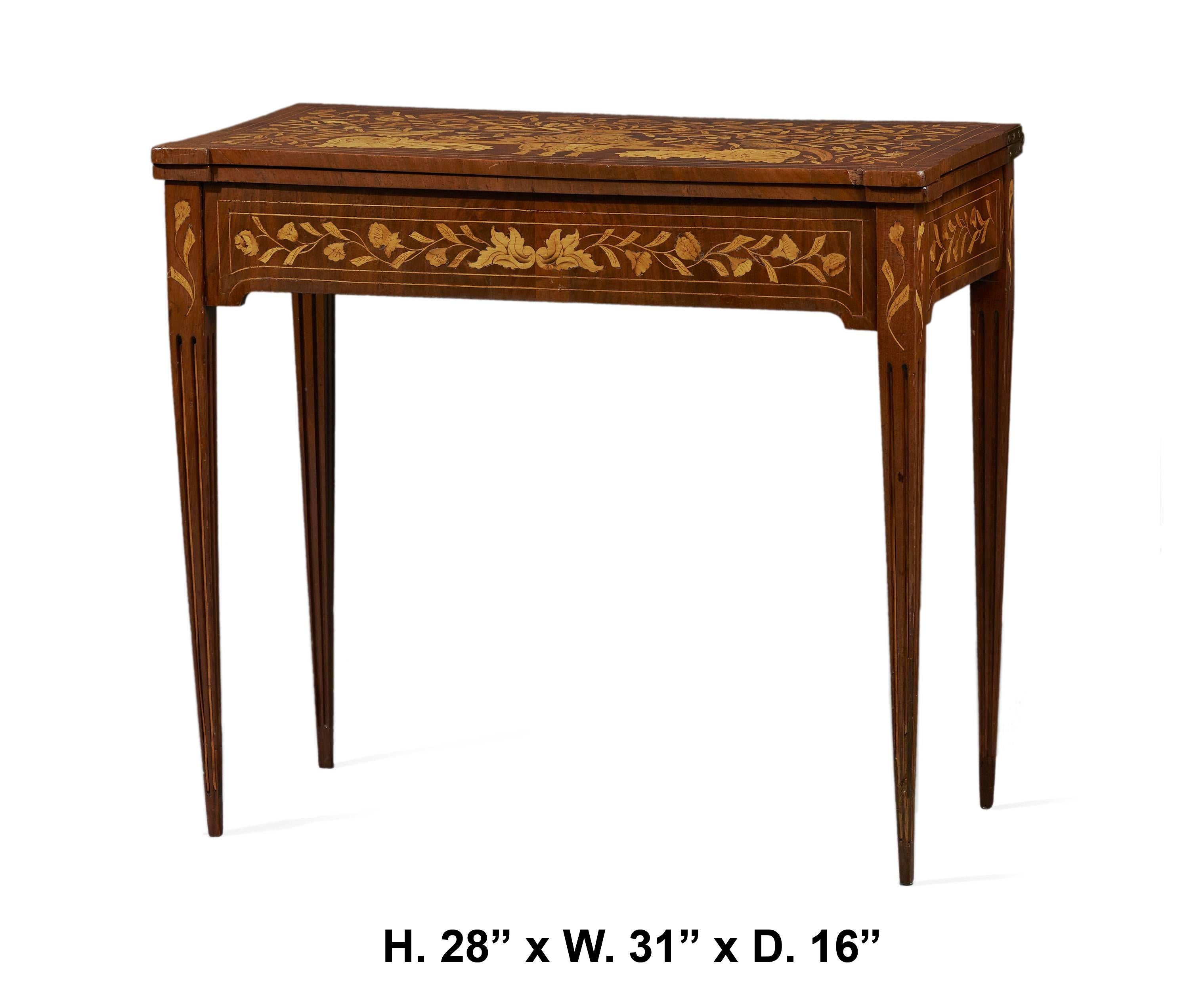 Lovely Dutch marquetry flip-top card table, 19th century.

The flip-top is decorated with intricate marquetry depicting a central floral bouquet flanked by two birds, revealing a green velvet interior, over a conforming banded frieze decorated in