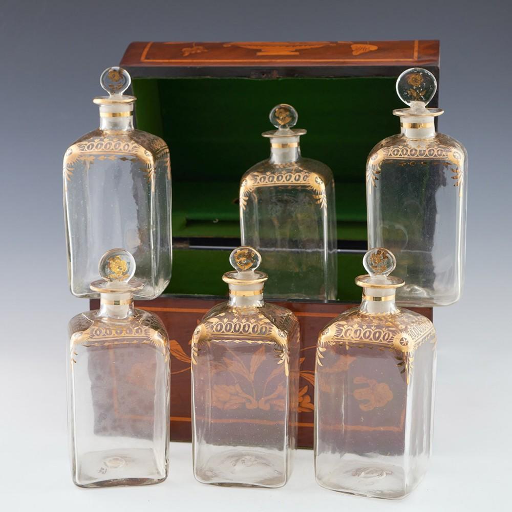 Dutch Marquetry Grog Box with Six Stoppered Bottles, 20th Century

Additional Information:
Heading : Dutch Marquetry Decanter Box with Six Stoppered Bottles
Date : 20th century
Origin : Netherlands
Decoration : In the style of an early 19th century