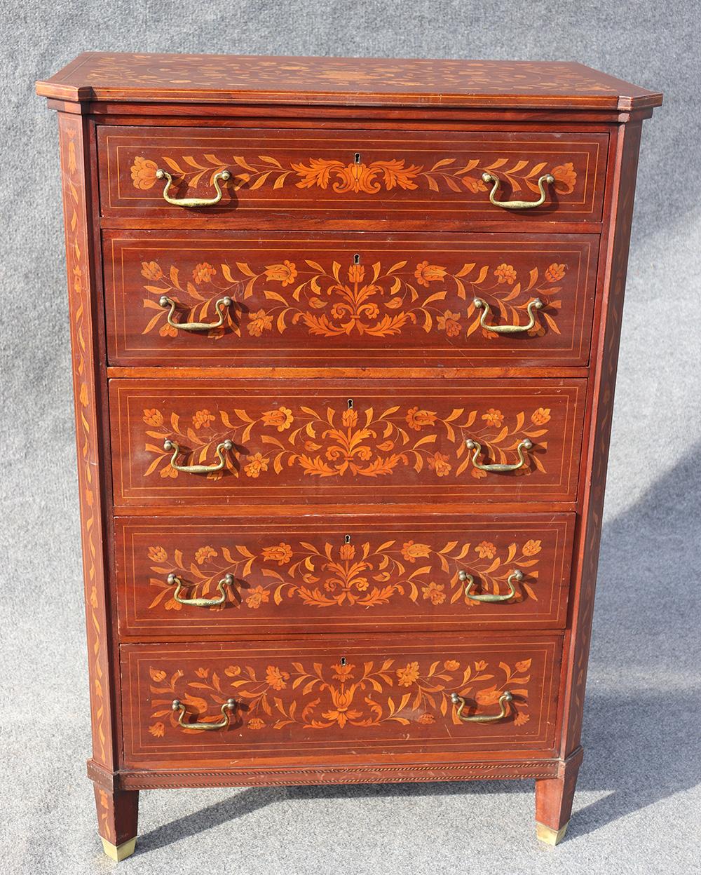 This gorgeous 5-drawer tall dresser was made circa 1900-1910 and looks like RJ Horner of New York. The Dutch Marquetry case is just beautifully inlaid.