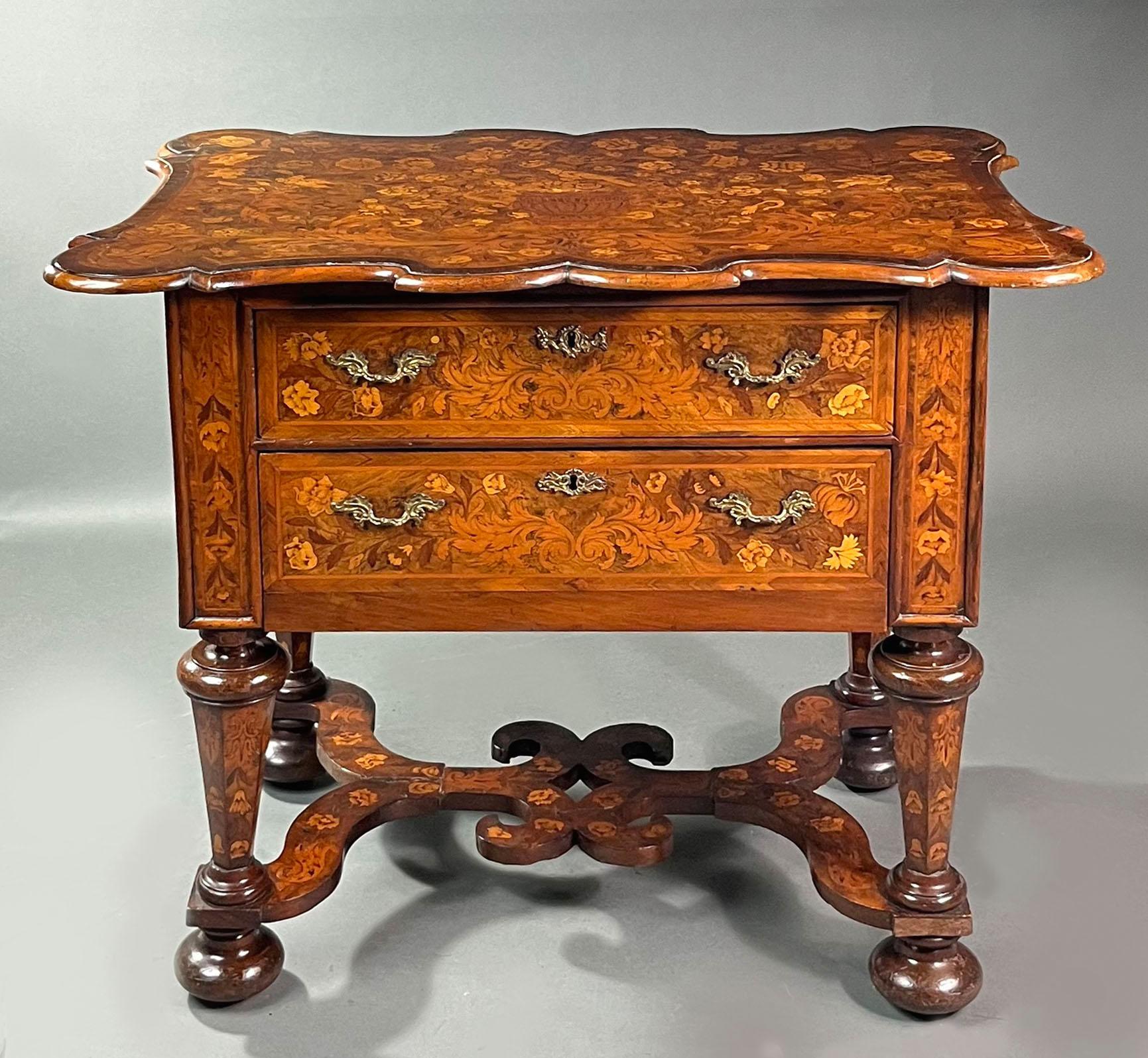 Dutch marquetry side table
Late 18th/early 19th Century figured walnut Dutch Baroque side table, with fine marquetry inlay of birds and foliage, handsome X-stretcher and oak lined drawers