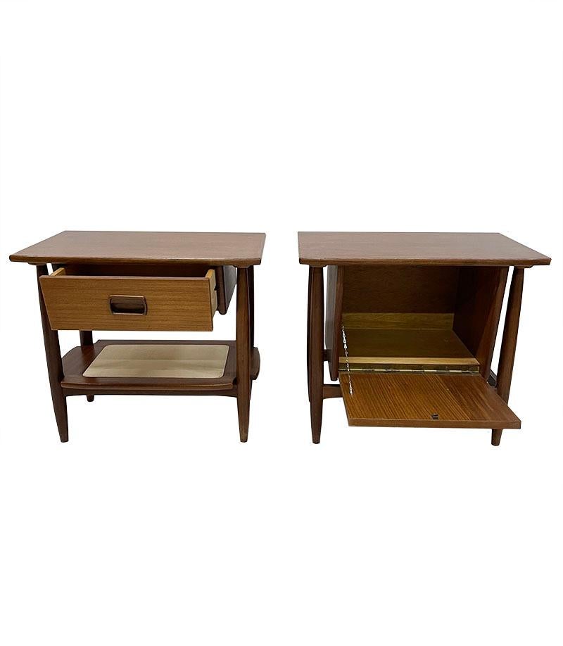 Dutch Mid-20th century small bedside tables

1960s small teak bedside tables with 1 table with a drawer and a shelf, the 2nd with a flap. Nice square tables with round shapes as ladies and a men's model next to the bed. 
The measurement is 49 cm