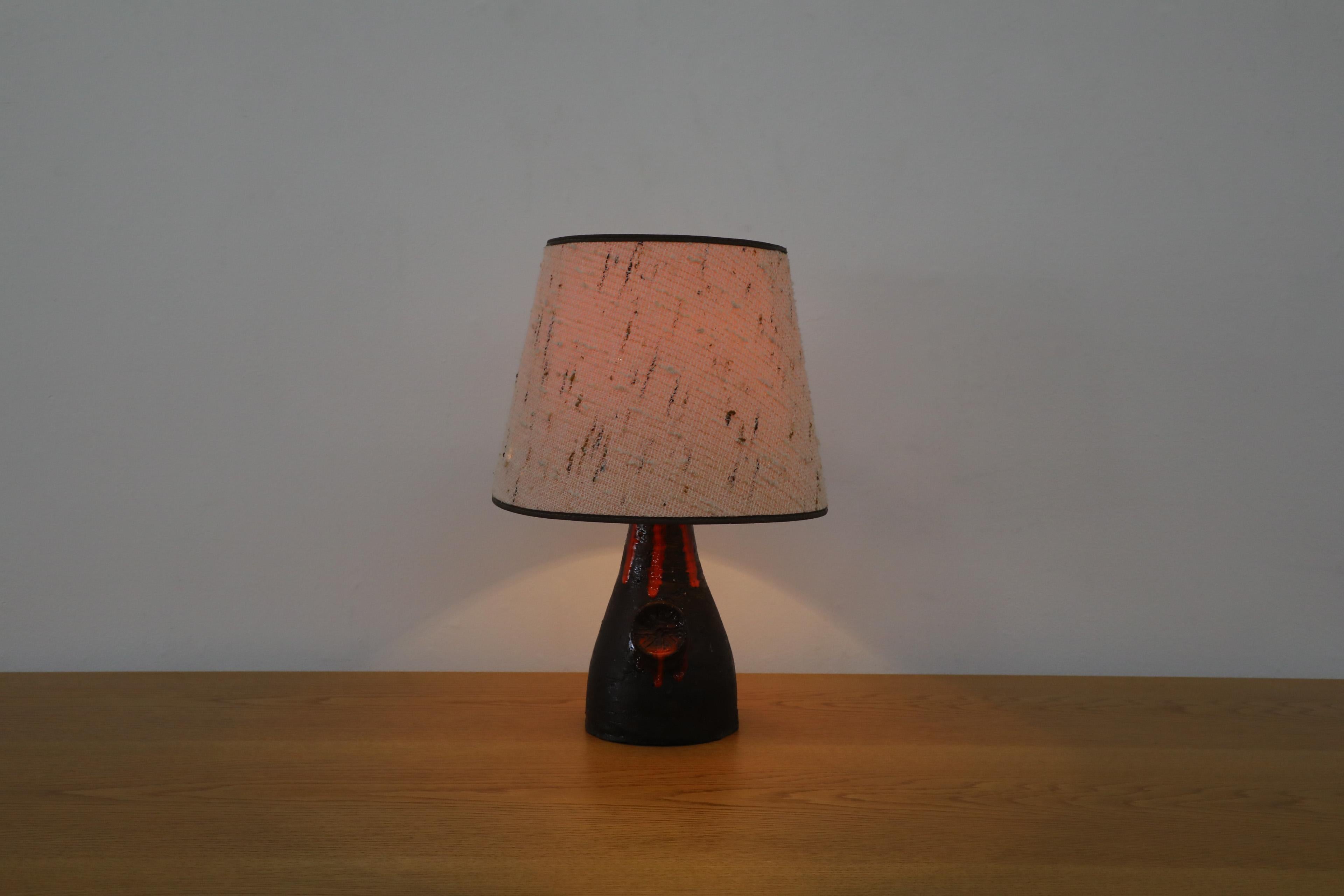 German Dutch Mid-Century Black Ceramic Volcanic Table Lamp w/ Red Dripping Effect Glaze For Sale
