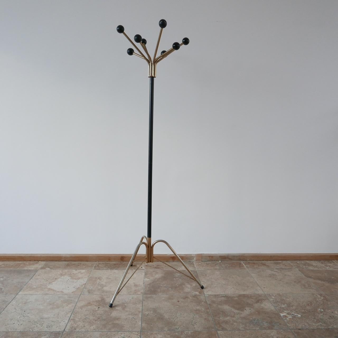 A tall stylish coat rack. 

Holland, c1970s.

Sputnik style protruding balls for each coat.  

Good vintage condition. 

Internal ref: UK.

Location: London Gallery.

Dimensions: 68 W x 68 D x 172 H in cm.

Delivery: POA

We can ship around the