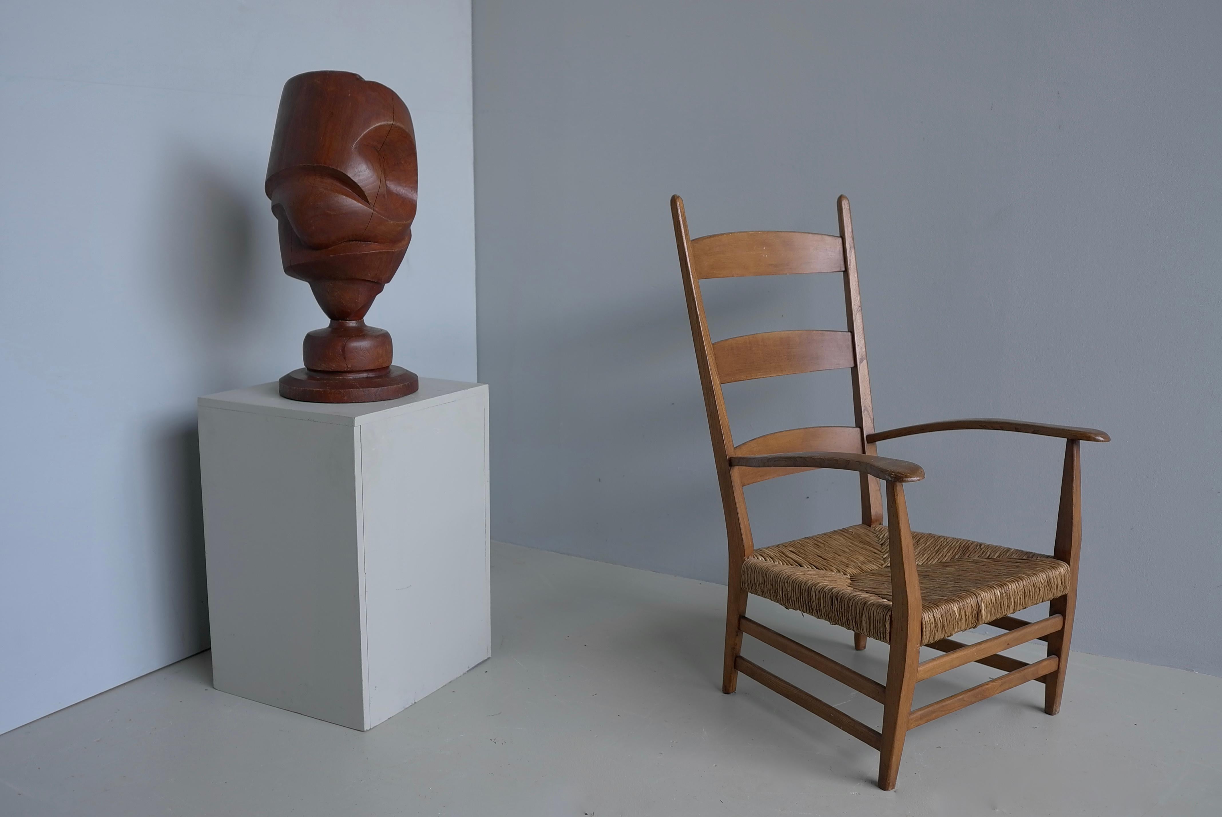 Dutch Mid-Century modern Organic Armchair with Rush seat made early 1950's. This Chair is often attributed to Bas van Pelt.

The construction of this rare 1950s design is simple at its core, but thanks to the details, it is a unique representation