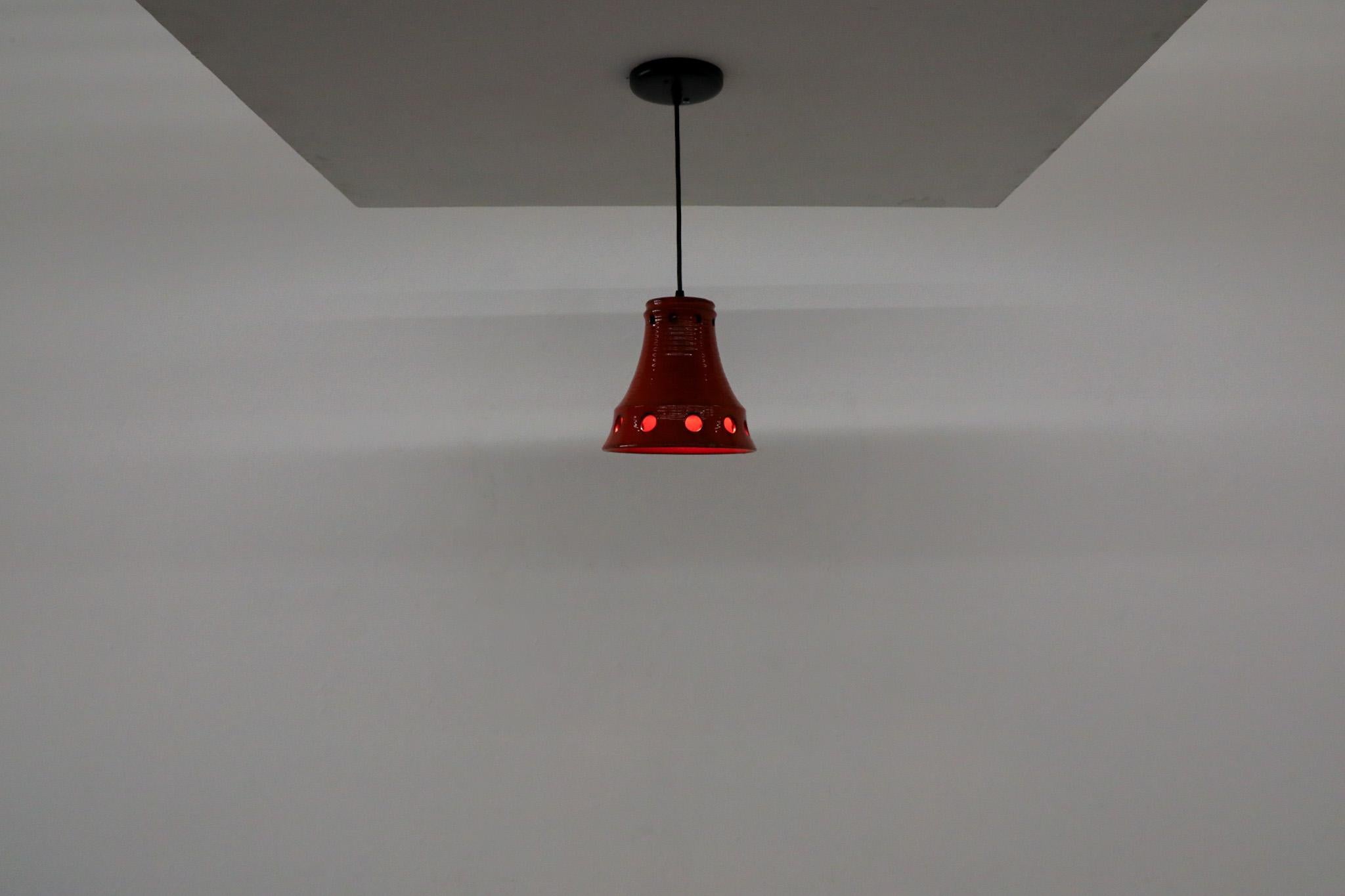 Mid-Century Modern Dutch Mid-Century Red Ceramic Bell-Shaped Pendants with Cut-Outs by Herda For Sale