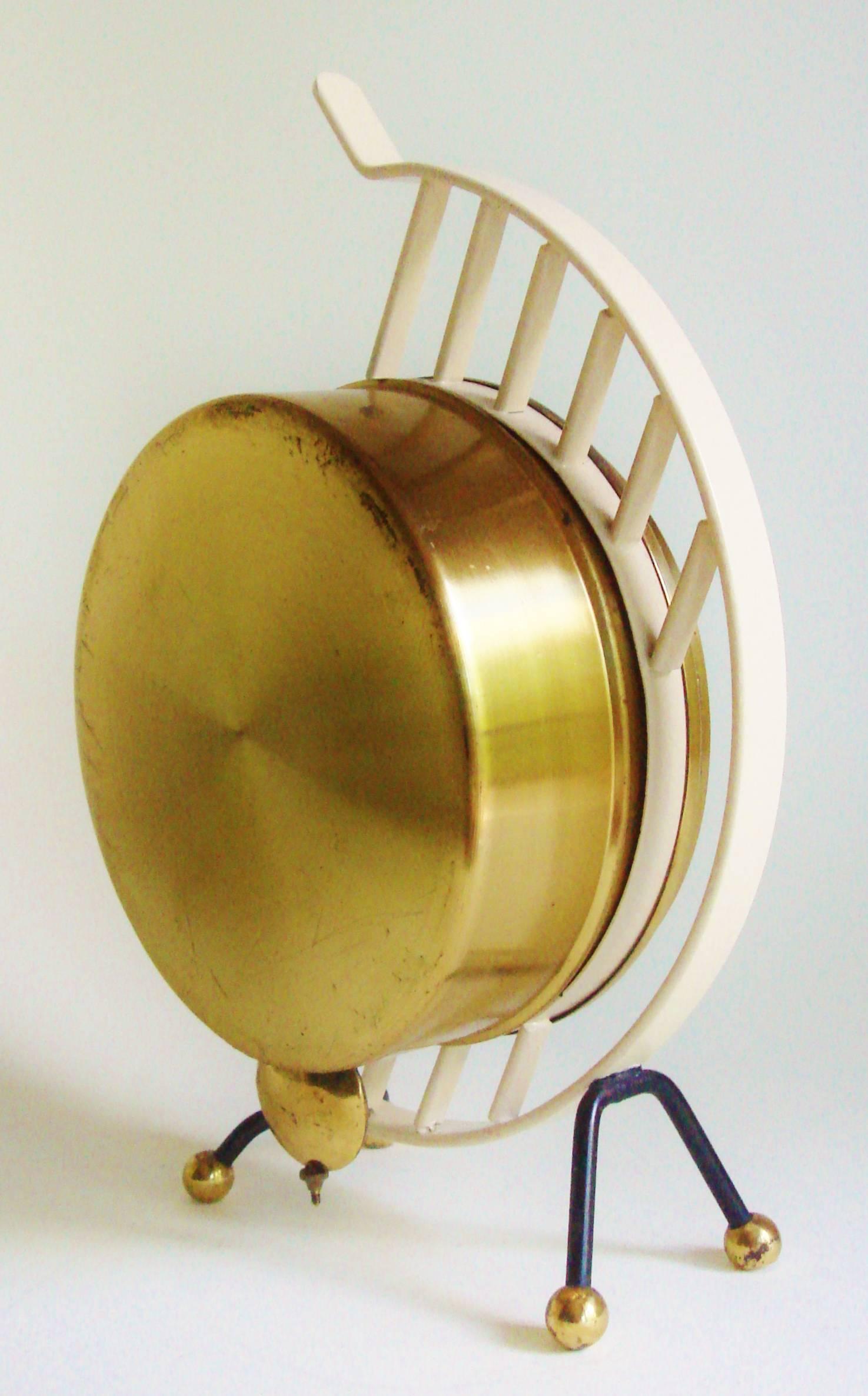 The Avant Garde design of this 1960s, chiming (on the hour and on the half hour), pendulum, mechanical mantel clock is typical of the work of the Dutch clock-makers, Orfac of Rogan, Holland. During the 1960s Orfac produced some of the most radically