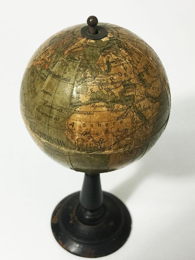 Dutch miniature terrestrial globe on wooden base, 16 cm high

A miniature globe made of papier mâché with Dutch text on a wooden stand,
circa 1900

Used object
The measurements are 16 cm high and 8 cm diagonal
The weight is 50 gram.