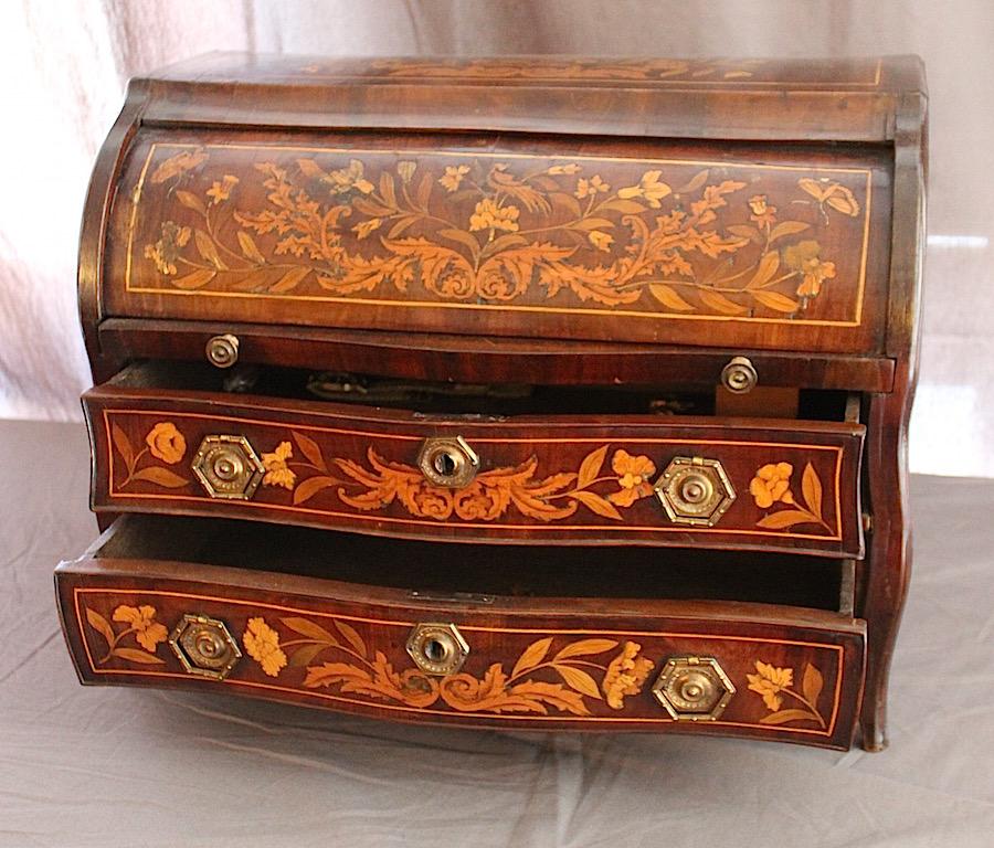 A Dutch walnut and marquetry inlaid salesman's model of a Bombe Bureau inlaid with fruitwoods. With seven miniature top drawers, a writing table two main drawers, lovely detail and very collectable, ormolu gilt bronze handles.