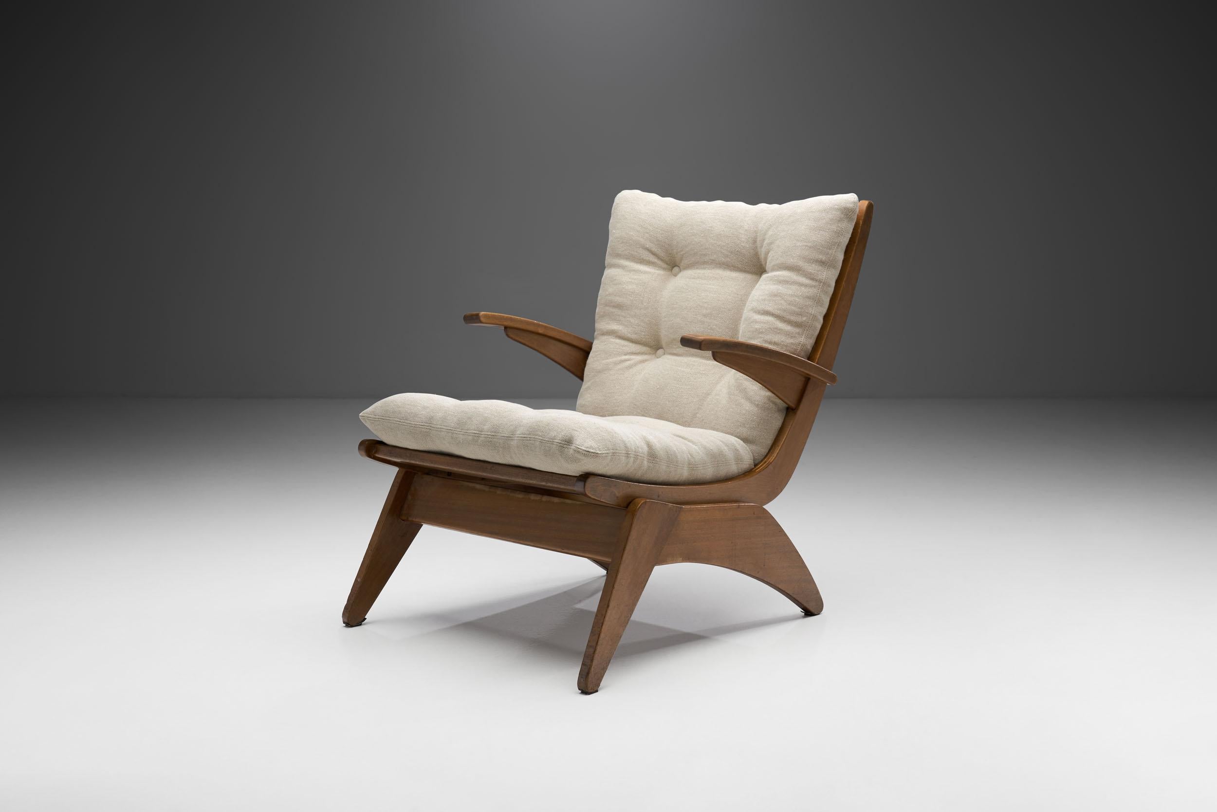 This armchair, like its high back kin, is an early and rare piece by Dutch furniture and interior designer, Jan den Drijver, representing Dutch Modernism. Slanting, oblique lines characterize the frame, which gives this chair a distinctive