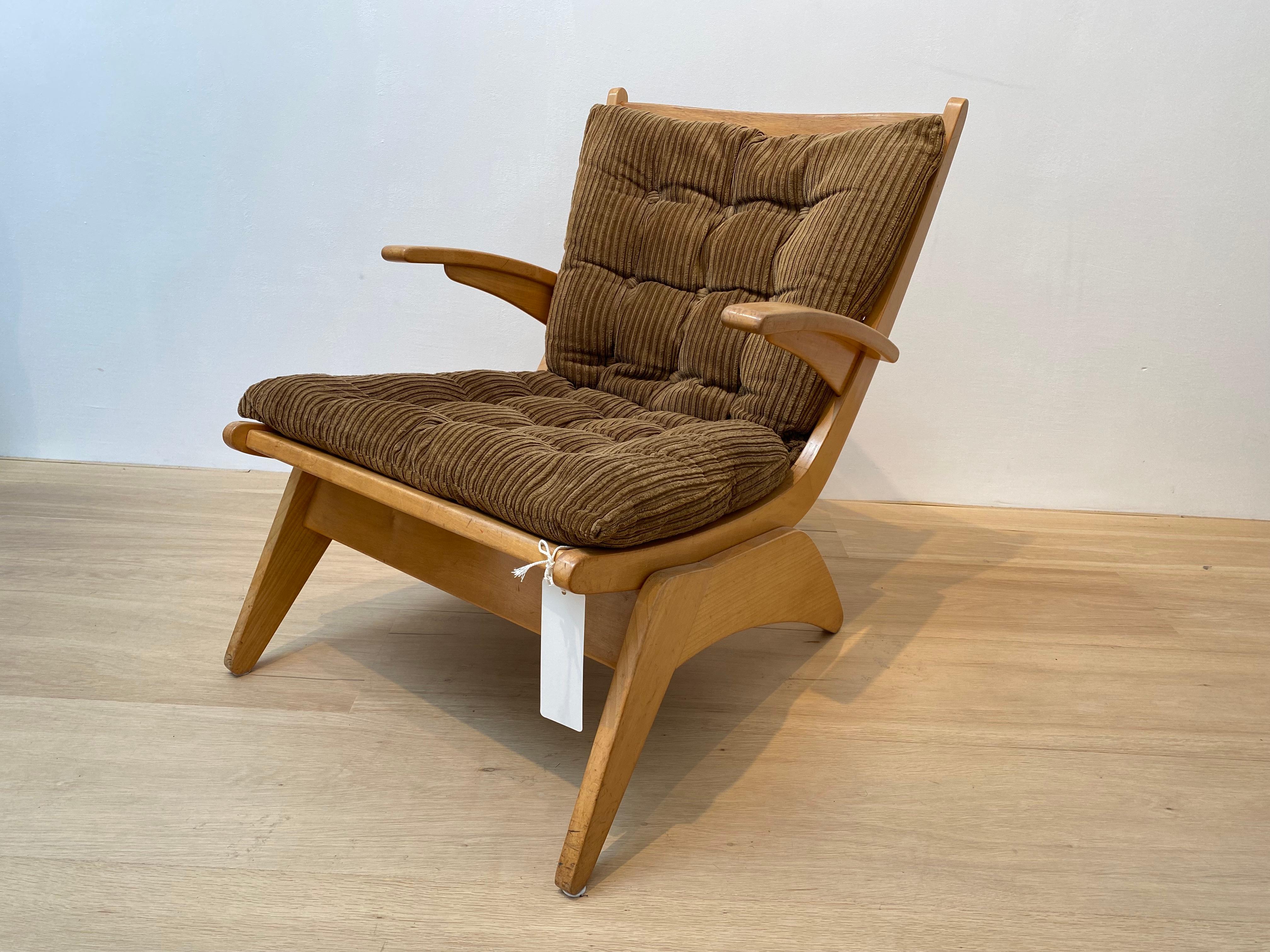 This armchair is an early and rare piece representing Dutch Modernism. Slanting, oblique lines characterize the frame, which gives this chair a distinctive shape.

Dutch mid-century furniture, such as this model, is defined by characteristics of