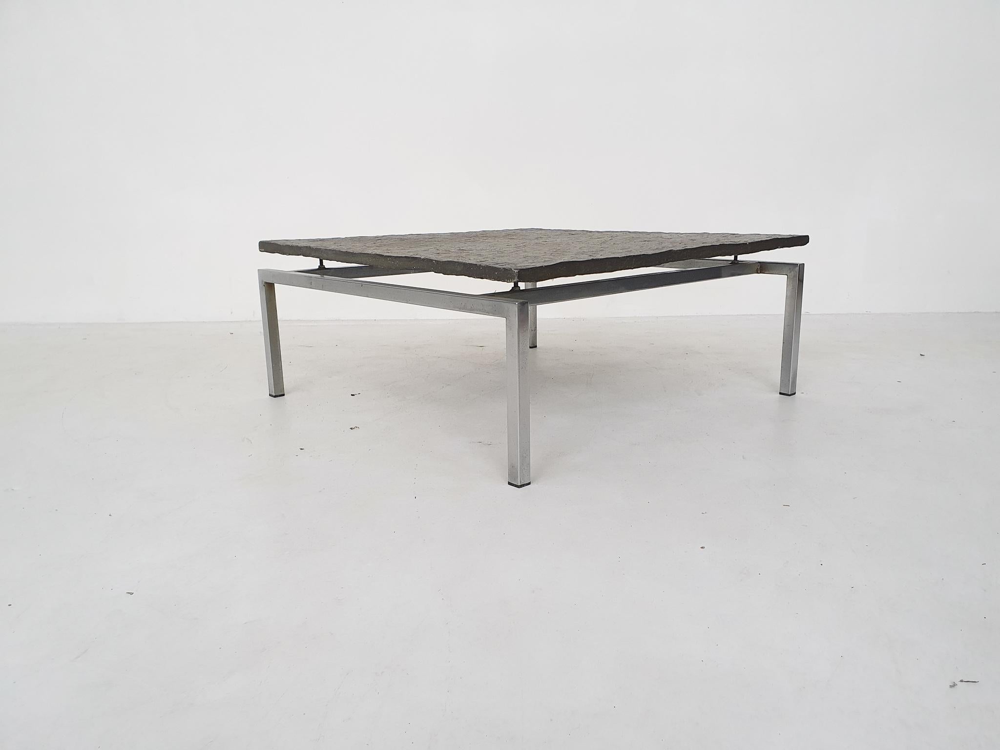 Dutch modern Brutalist slate and steel coffee tables, 1950s.

Heavy slate top resting on an iron frame. The slate top has a unique natural pattern. The table is made in the Netherlands, approximately around the 70's. The style is in the matter of