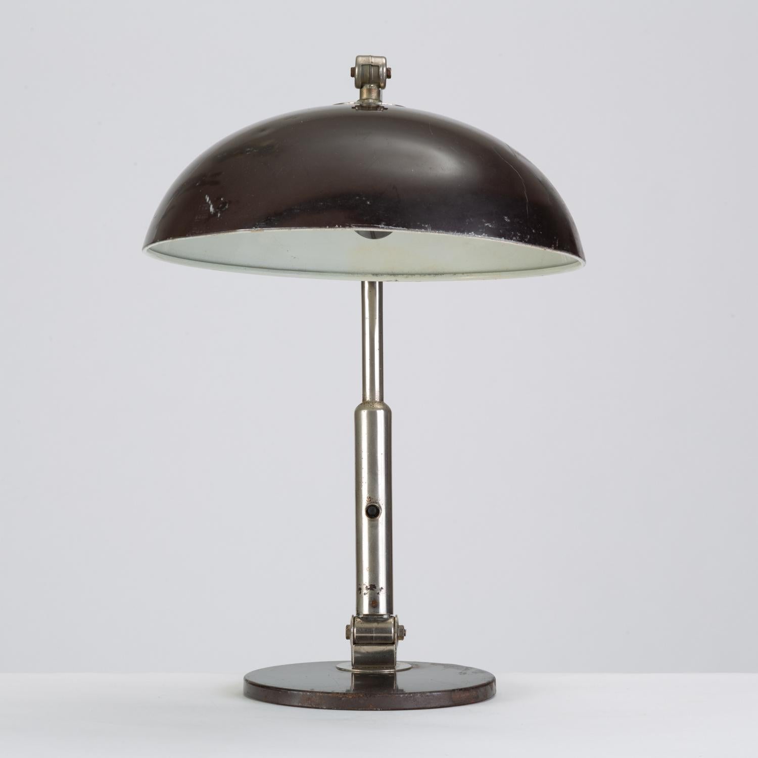 A rounded table lamp designed in 1932 by Herman Theodoor Jan Anthoin Busquet, lead designer for Zeist-based lamp importer and manufacturer, Hala. Influenced by De Stijl and Bauhaus styles, Busquet espoused a modernism that was playful and highly