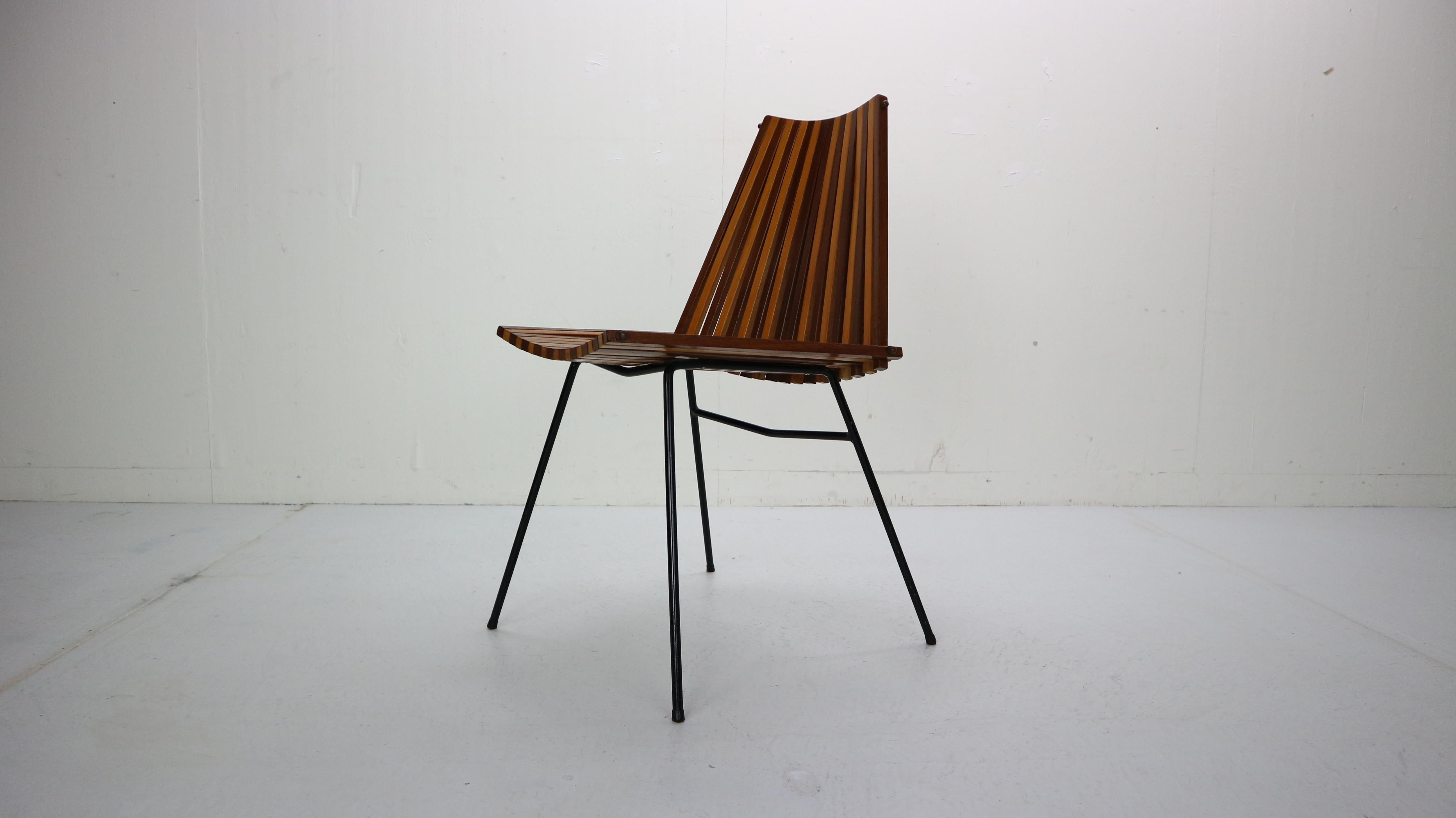 Elegant and special beautiful modernist chair, designed by Dirk van Sliedregt and made by Rohé Noordwolde in 1960s Netherlands.

This chair is made of steel rods with a back and seat, consists of 37 wooden slats in total. The slats are made of