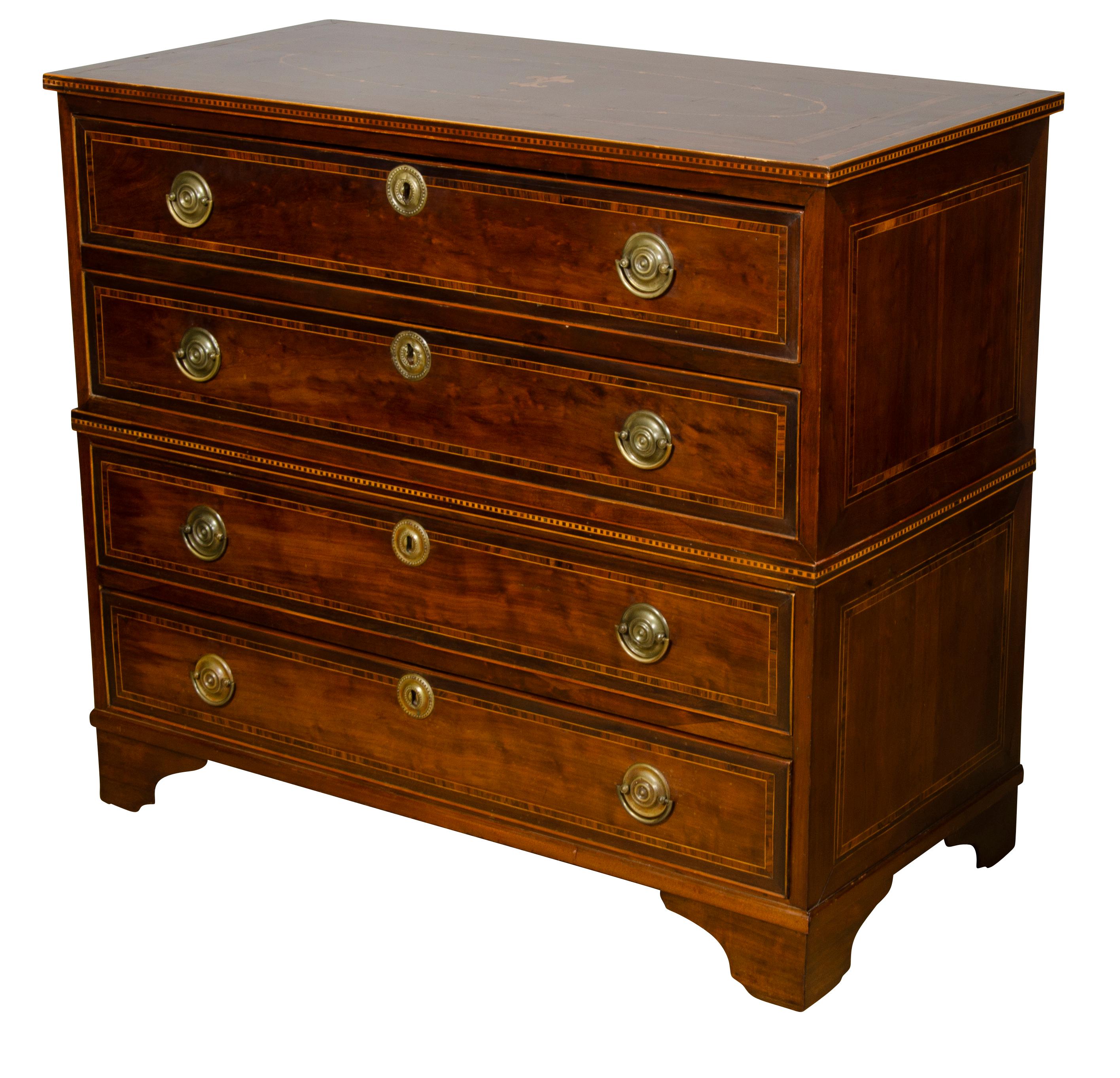 Made to come apart like a campaign chest with rectangular top with inlaid decoration over four drawers each with cross banded edge and brass handles, bracket feet.