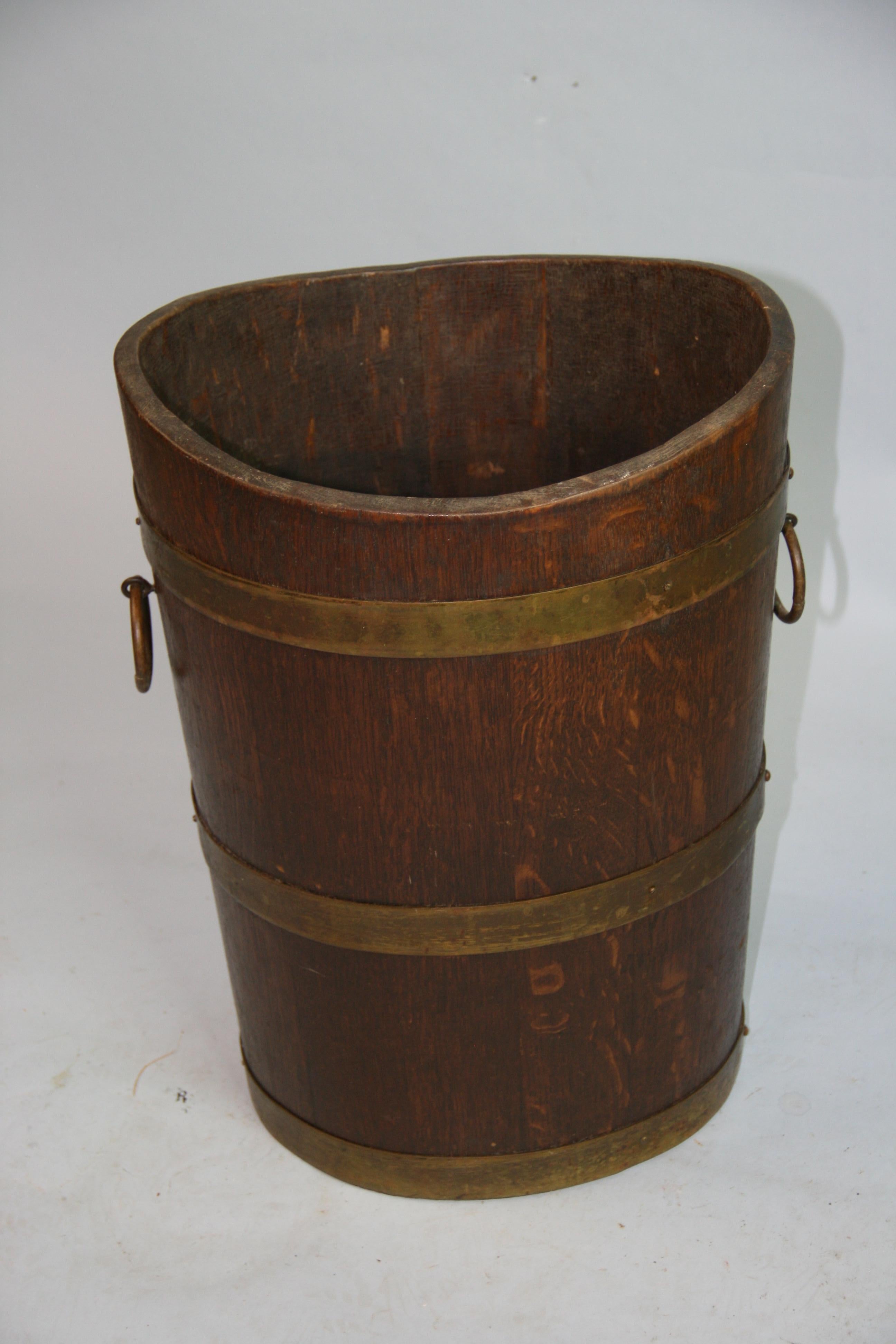 1292 Dutch oak and brass wood container.