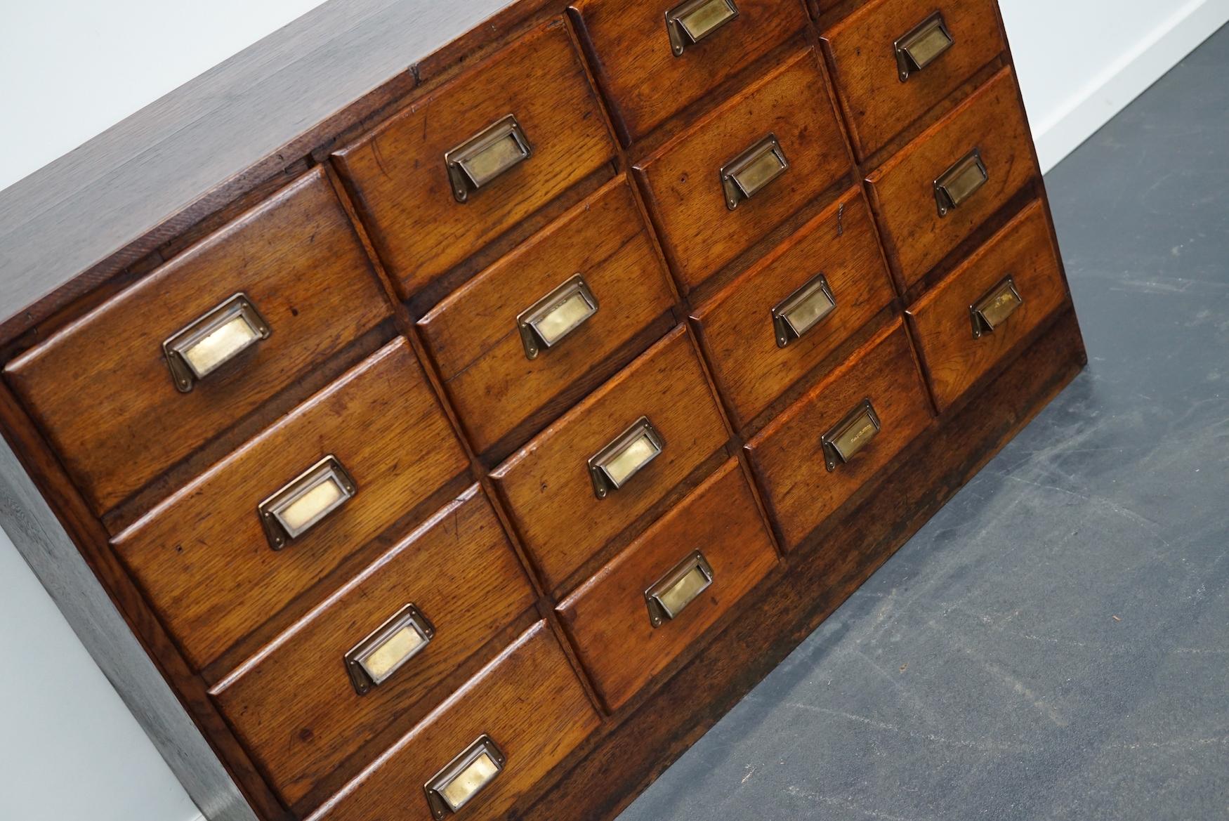 This apothecary cabinet was produced during the 1930s in The Netherlands. This piece features 16 decent sized drawers. The interior dimensions of the drawers are: D W H 32 x 21 x 12 cm and 31 x 26 x 12 cm.