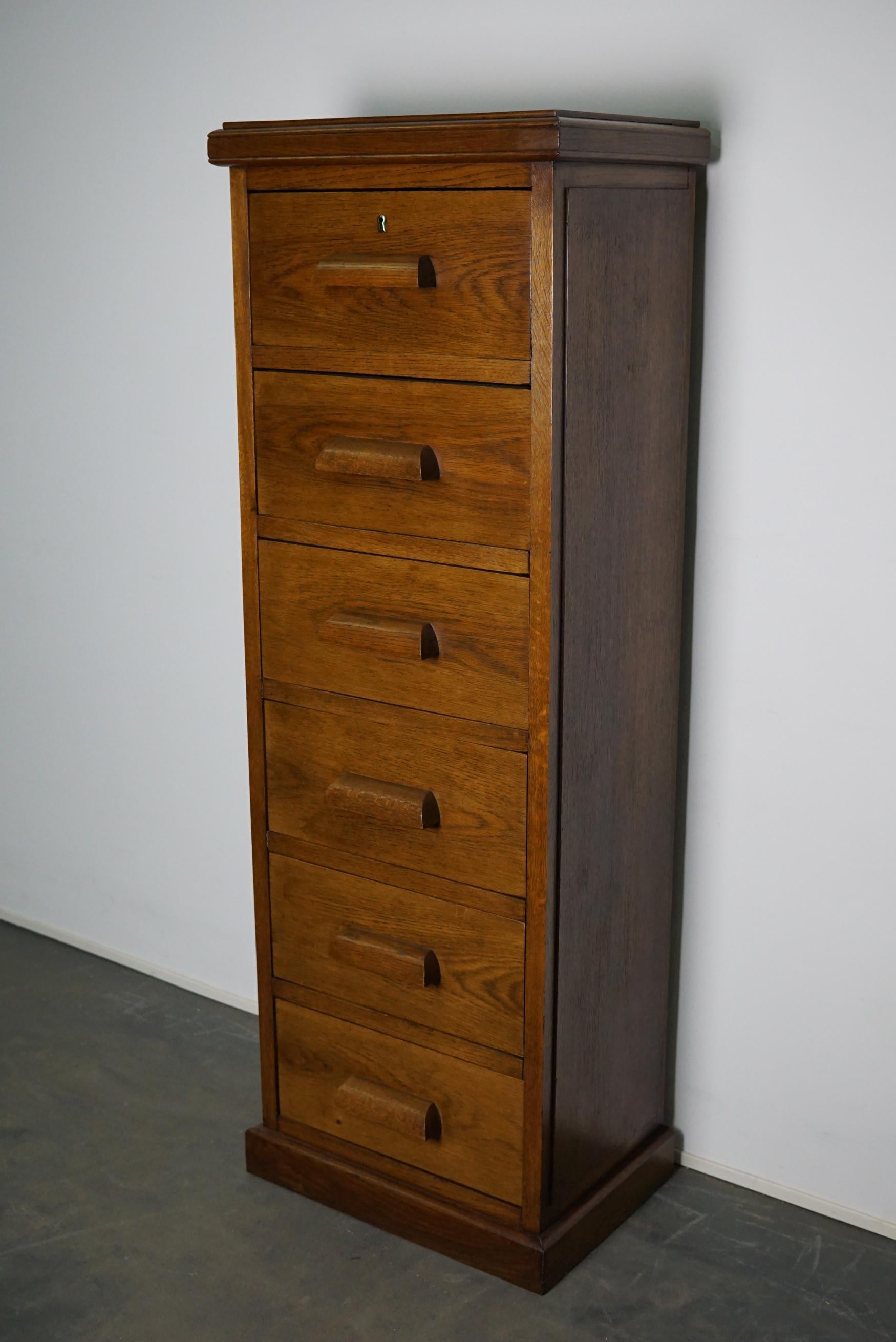 This apothecary cabinet was made circa 1930s in the Netherlands. It features 6 drawers with nice wooden handles. It is made from oak and it remains in a very good condition. The interior dimensions of the drawers are: D x W x H 27.5 x 41 x 17 cm.