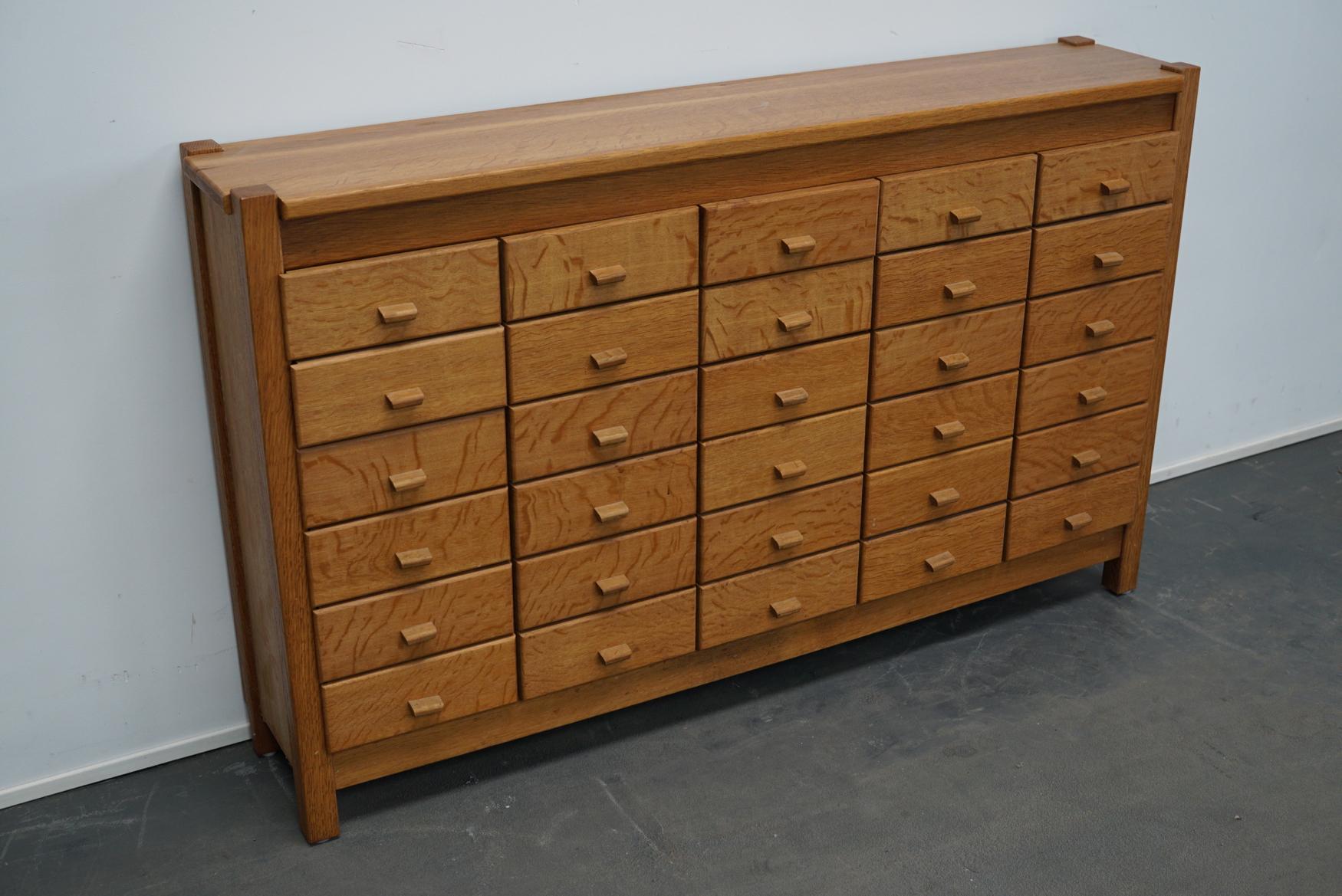 This apothecary cabinet was produced during the 1960s in the Netherlands. This piece features 30 drawers with wooden pulls. The interior dimensions of the drawers are: D x W x H 19 x 19 x 5.5 / 8 cm.
  