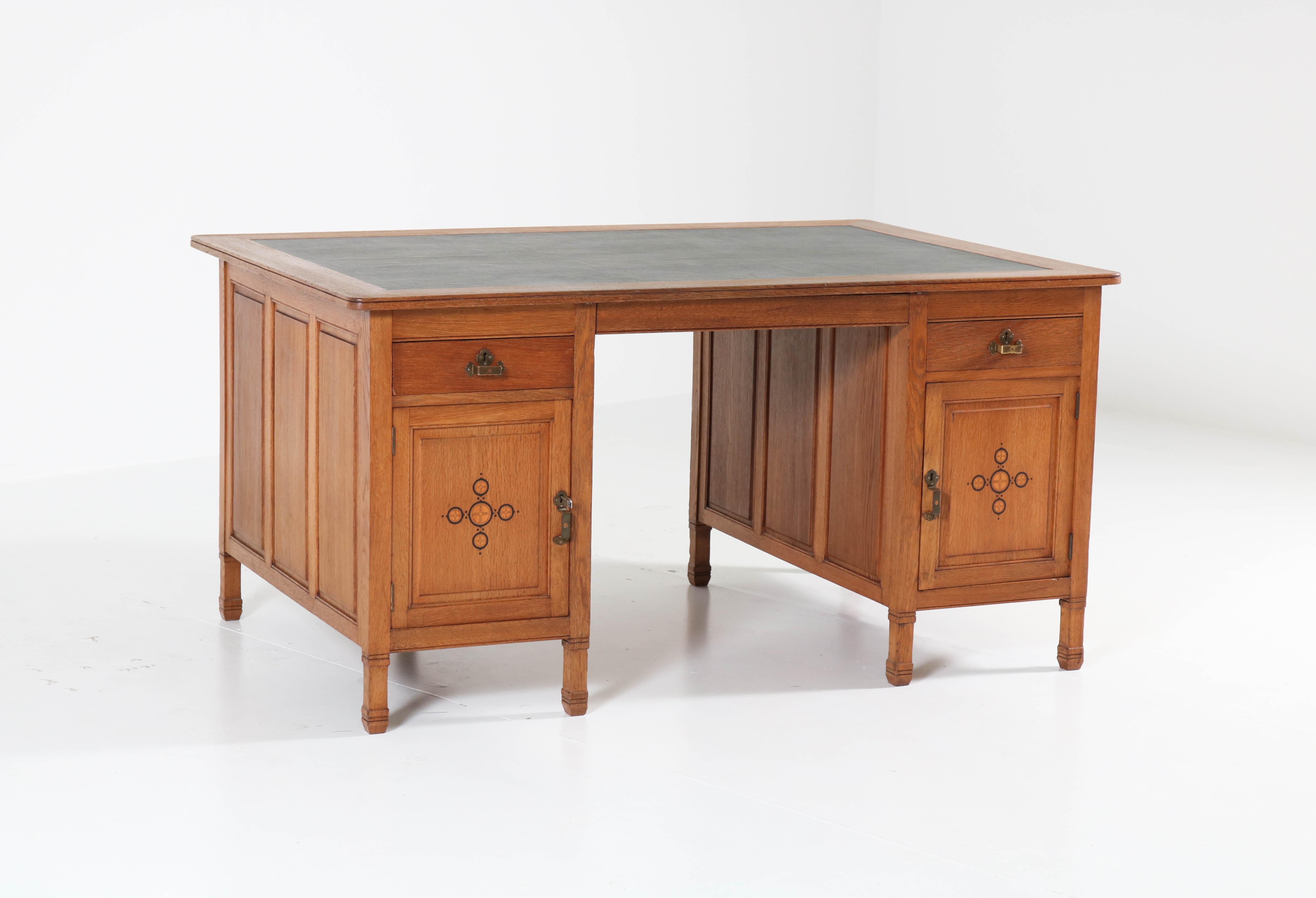 Elegant and rare Art Nouveau Arts & Crafts partners desk.
Design by K.P.C. de Bazel.
Striking Dutch design from the 1900s.
Solid oak with original brass handles and inlay.
In good original condition with minor wear consistent with age and