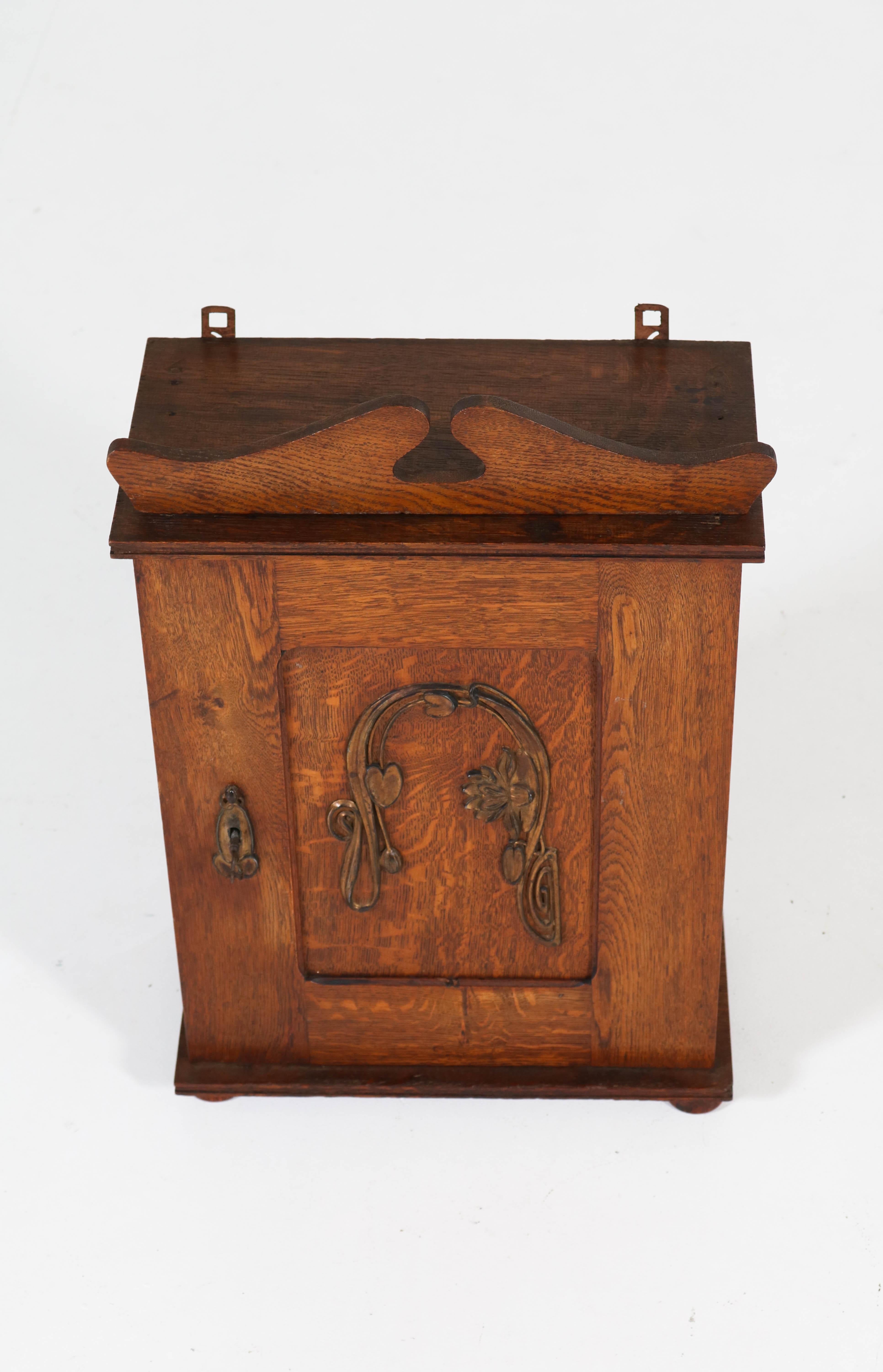 Dutch Oak Art Nouveau Arts & Crafts Wall Cabinet with Brass Decor, 1900s In Good Condition In Amsterdam, NL