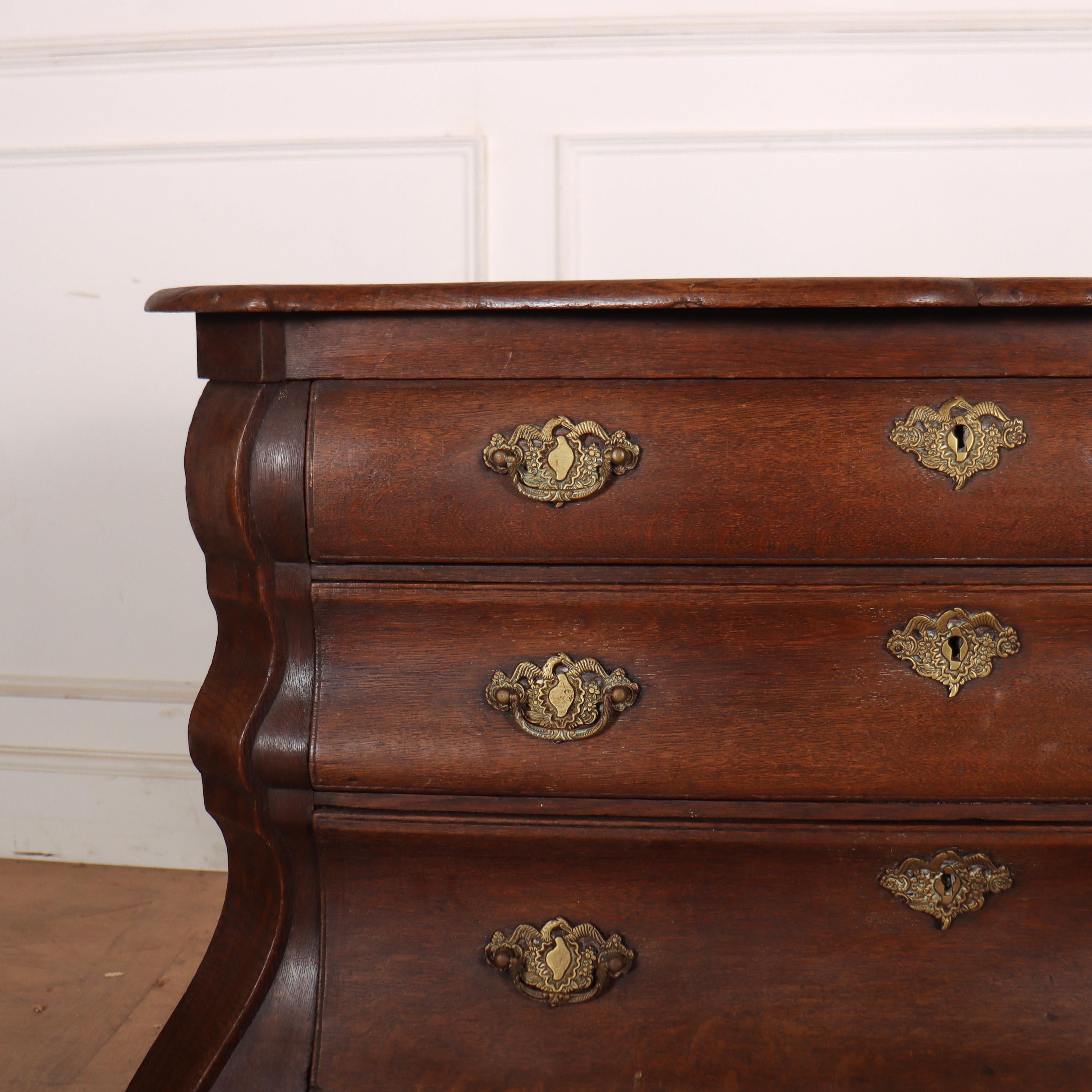 18th century Dutch oak bombe commode. Good shape and lovely colour. 1790.

Code: 8612

Dimensions:
W: 41