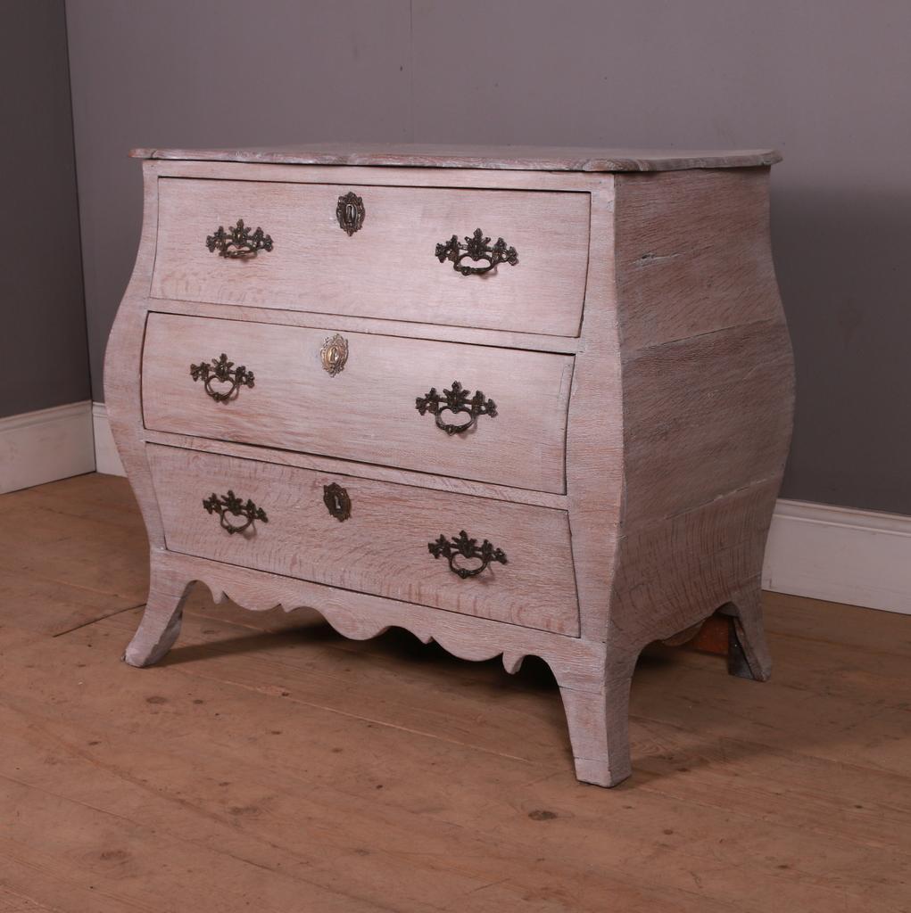 Early 19th C Dutch bleached and limed oak bombe shaped commode.1820.

Dimensions
36.5 inches (93 cms) wide
19.5 inches (50 cms) deep
32.5 inches (83 cms) high.