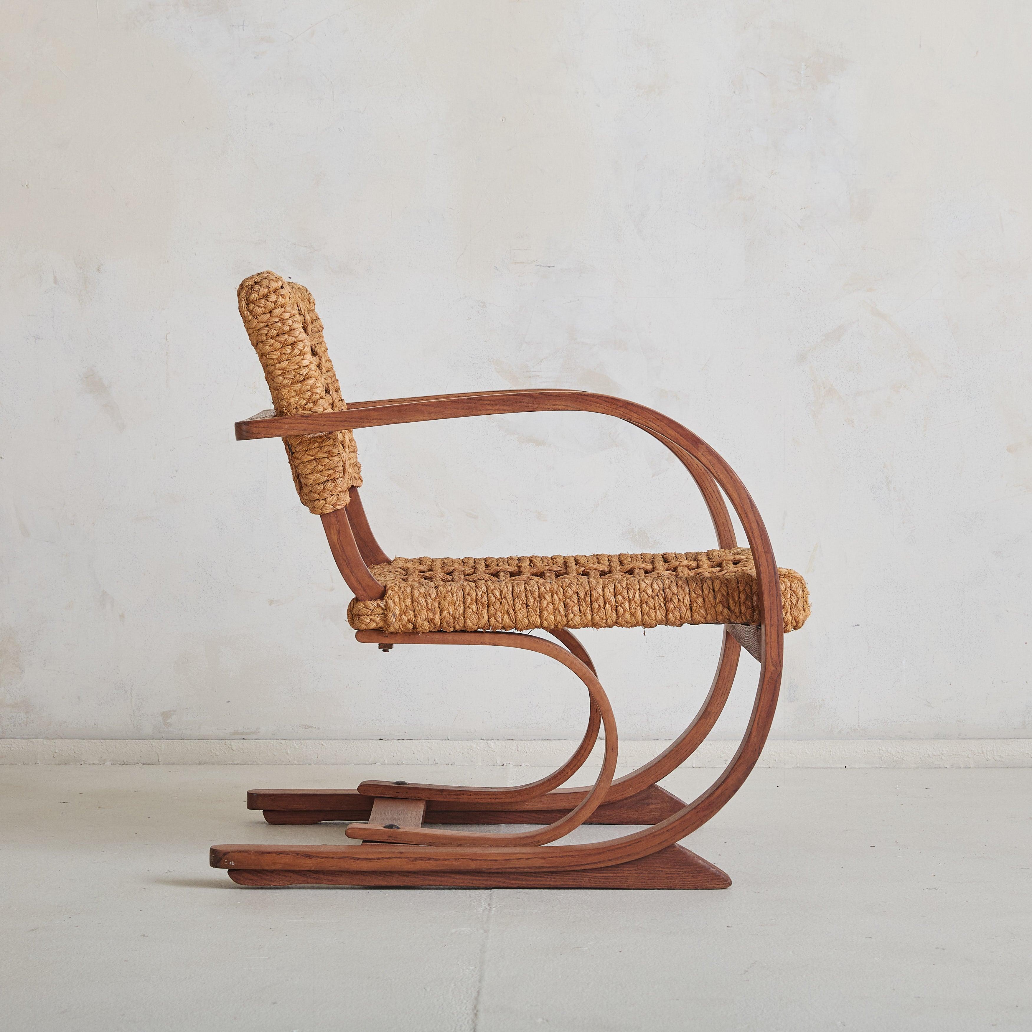 A rare Dutch lounge chair by interior architect and designer Bas van Pelt. Crafted for My Home Netherlands in 1936, this piece precedes the similar designs of Adrien Audoux and Frida Minet by nearly a decade. The chair features a gracefully curved