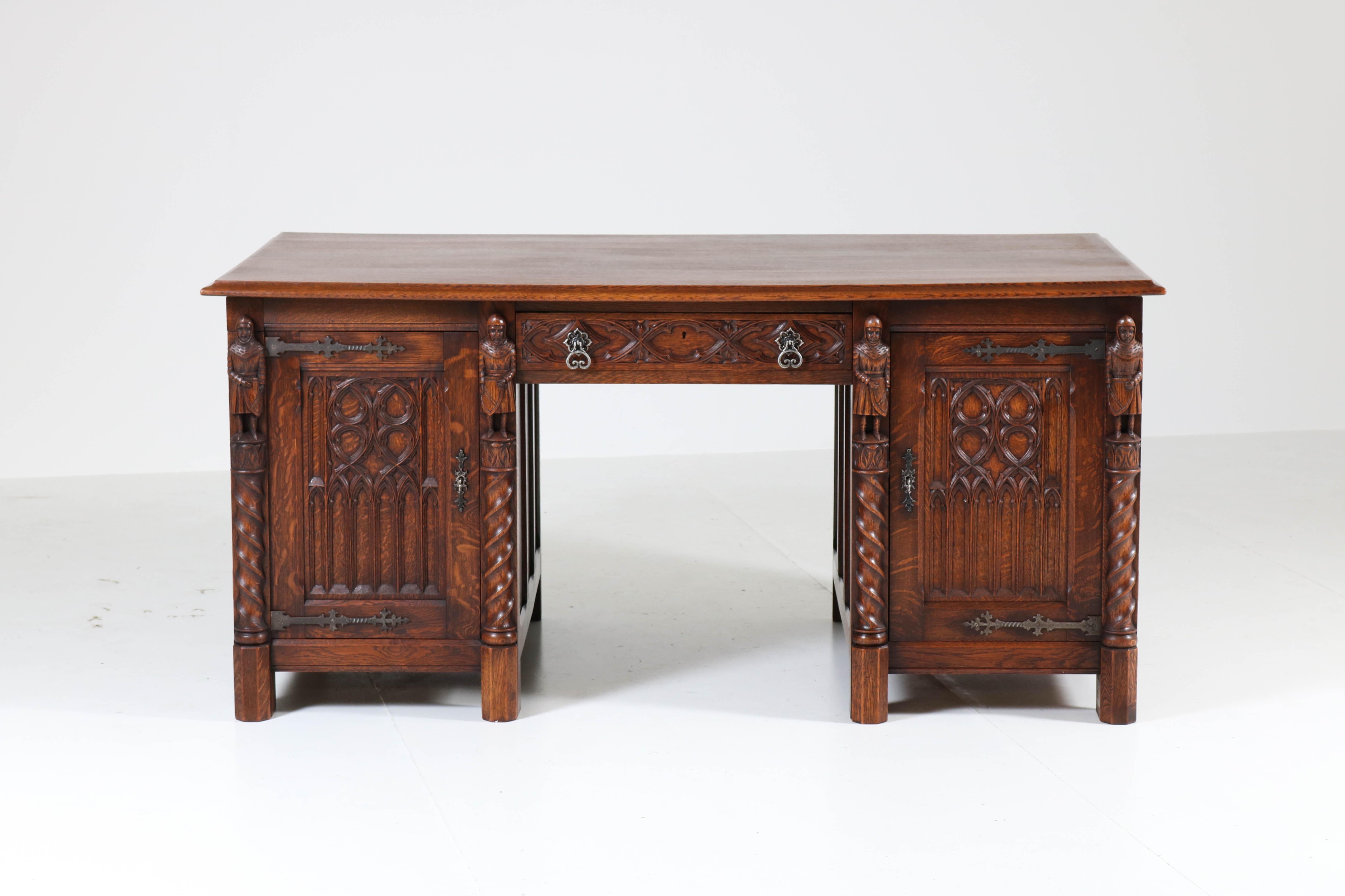 Wonderful Gothic Revival solid oak pedestal desk, 1940s.
With four hand carved knights and hand carved panels on the front with drawer.
Nice hand carved panels on the side as well on the backside, so
this stunning piece can be placed in the