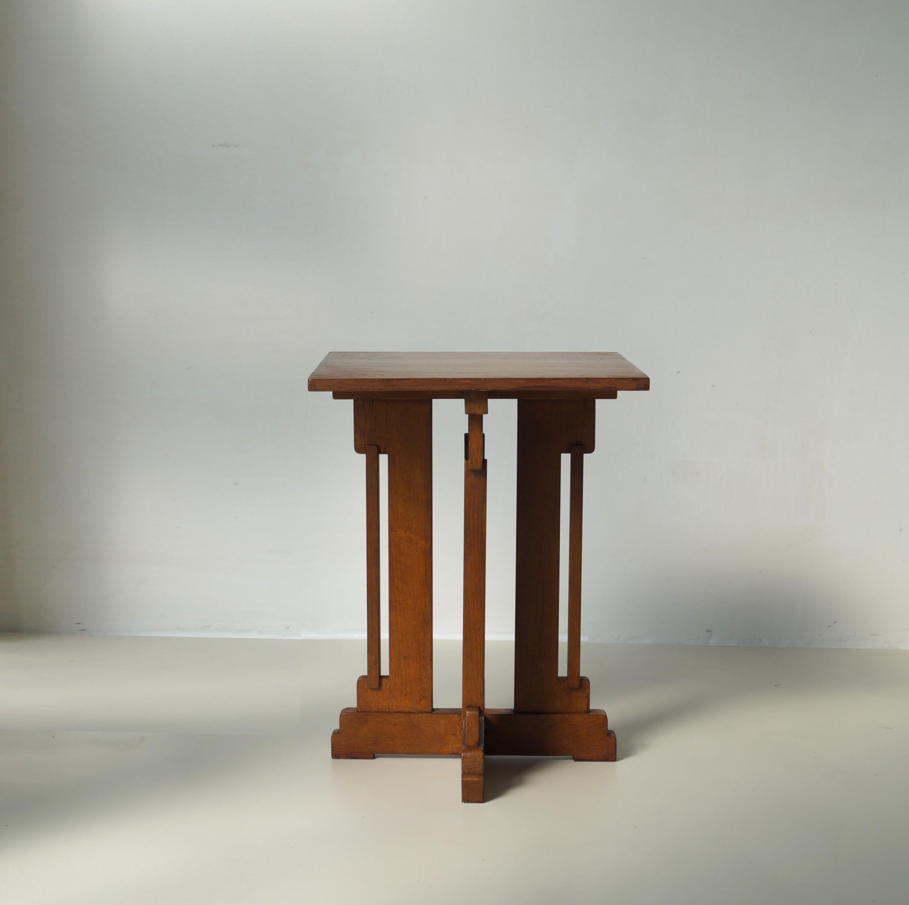 Architectural and eye catching occasional table from the Dutch Art Deco era, 1920s. Designed by P.E.L. Izeren for De Genneper Molen. 
The table has a modernist or ''Haagse School'' design.  This modestly sized table with its intricate design